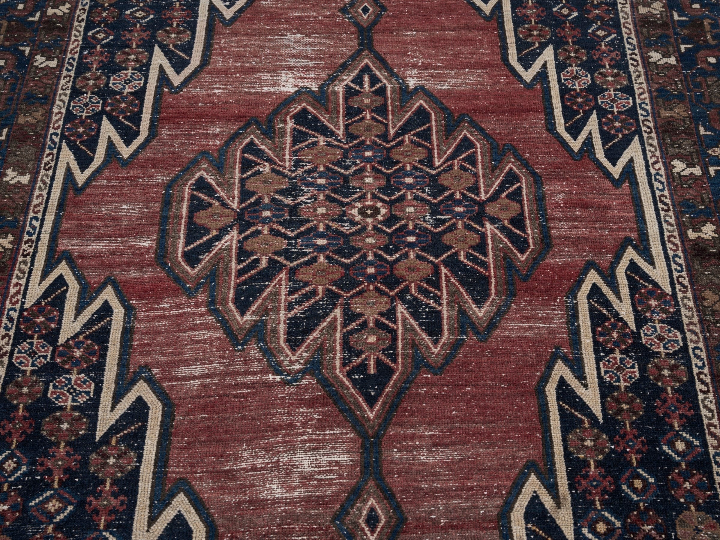 Persian Saveh accent rug in rust and navy, view 4 of 10
