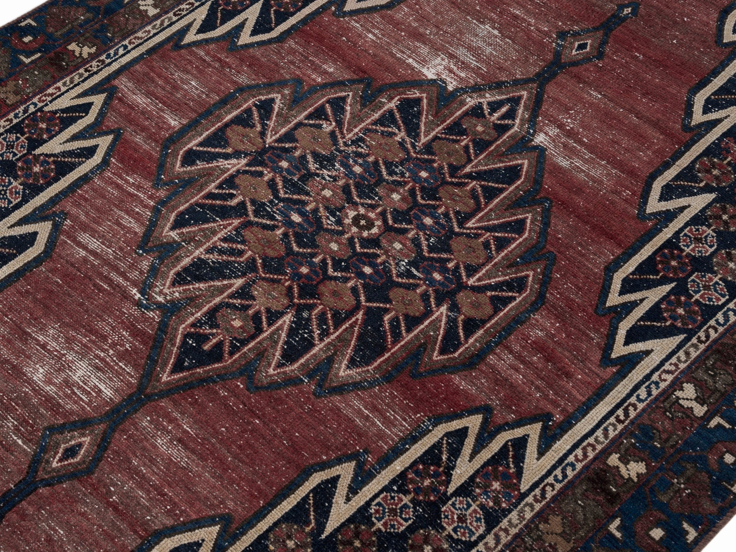Persian Saveh accent rug in rust and navy, view 5 of 10