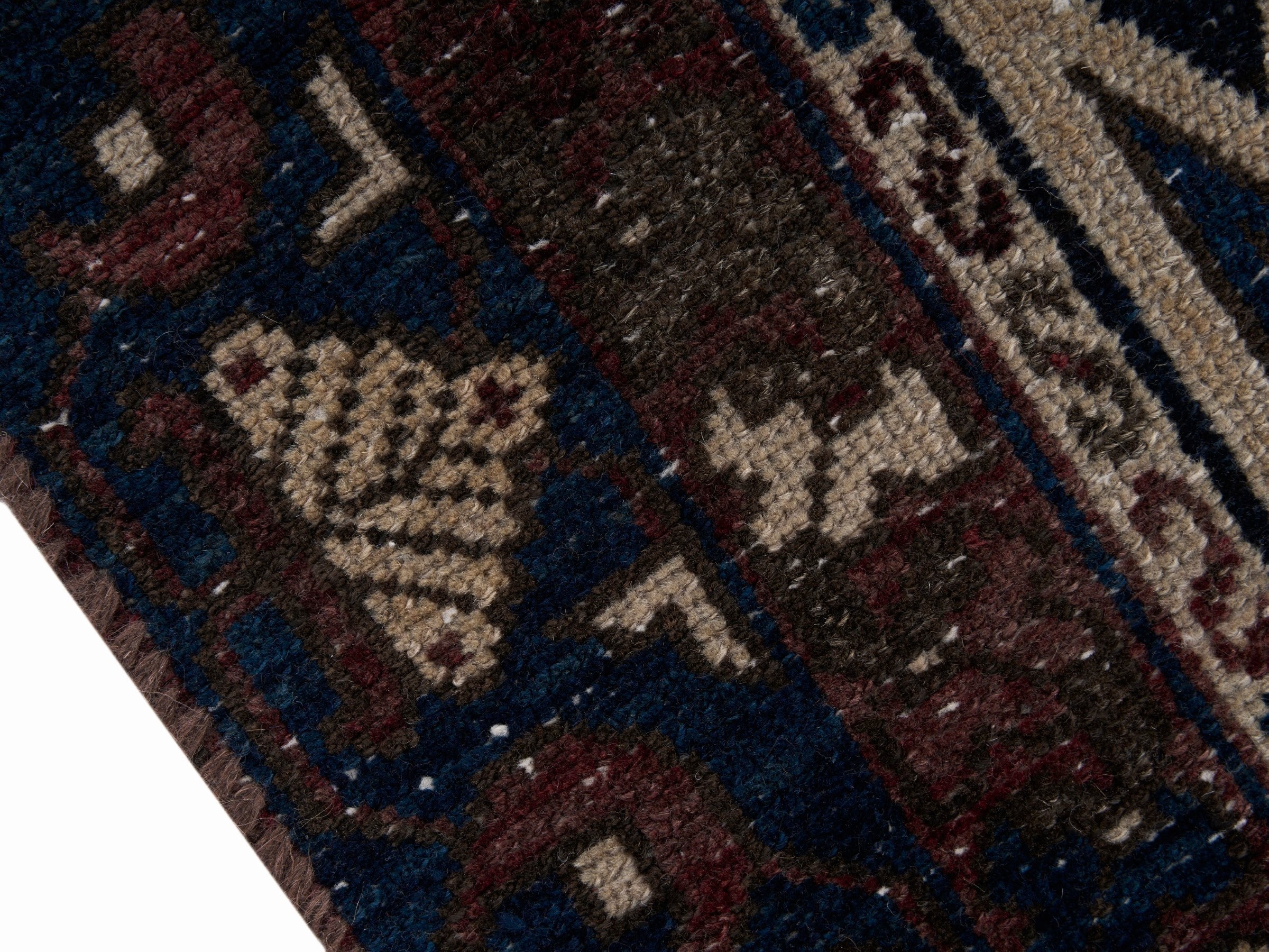 Persian Saveh accent rug in rust and navy, view 6 of 10