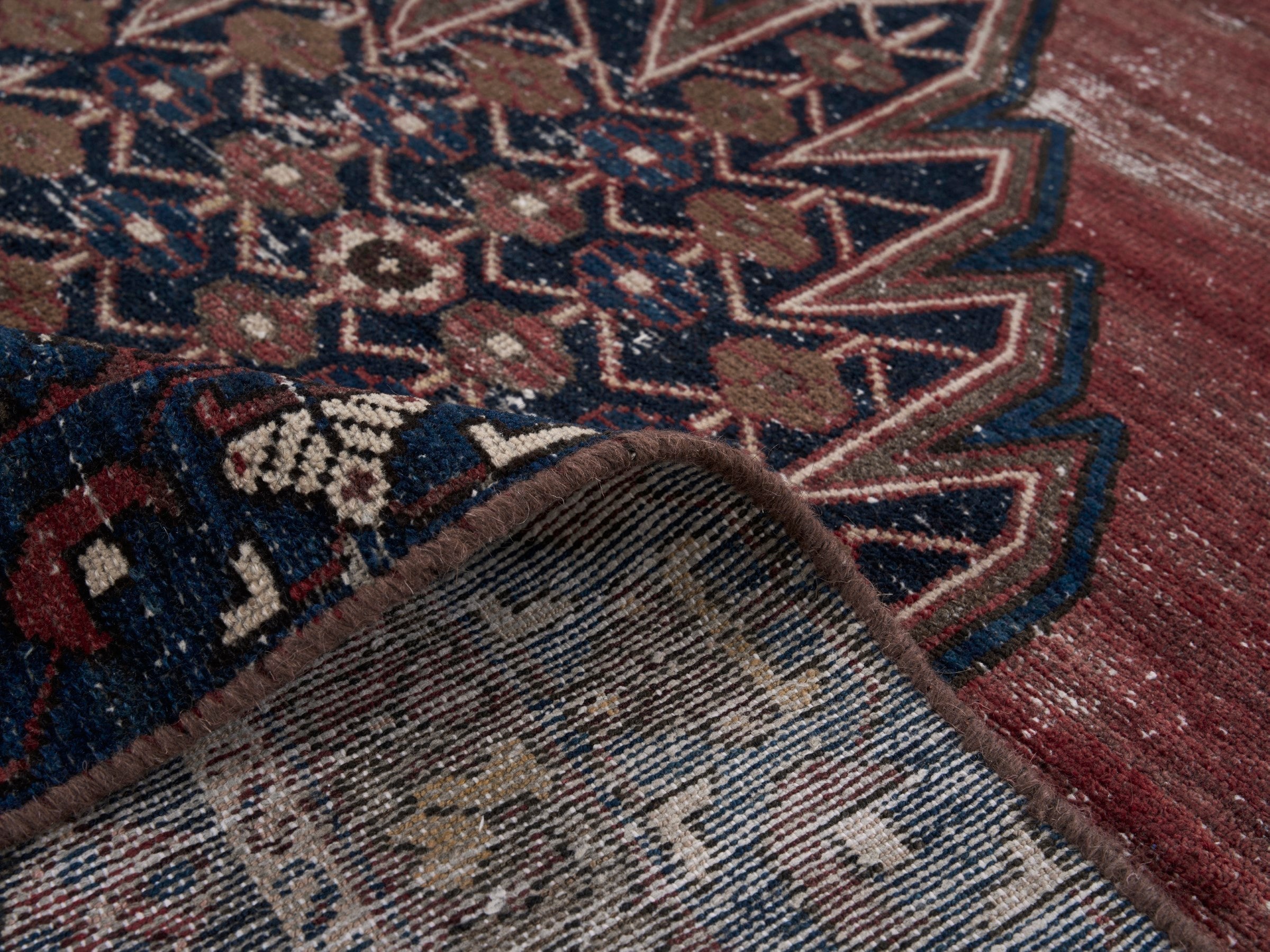 Persian Saveh accent rug in rust and navy, view 9 of 10