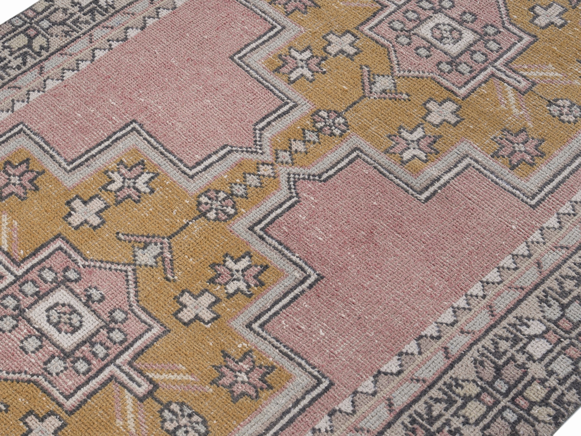 Turkish Anatolian runner rug in muted pink and mustard, view 5 of 10