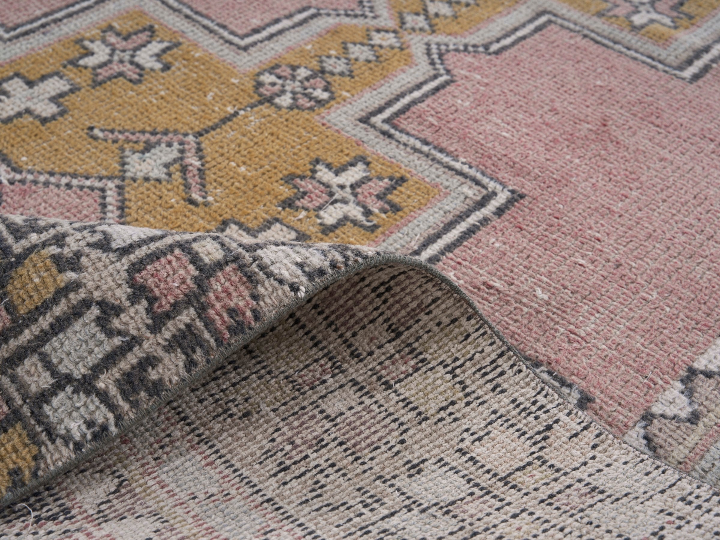 Turkish Anatolian runner rug in muted pink and mustard, view 9 of 10