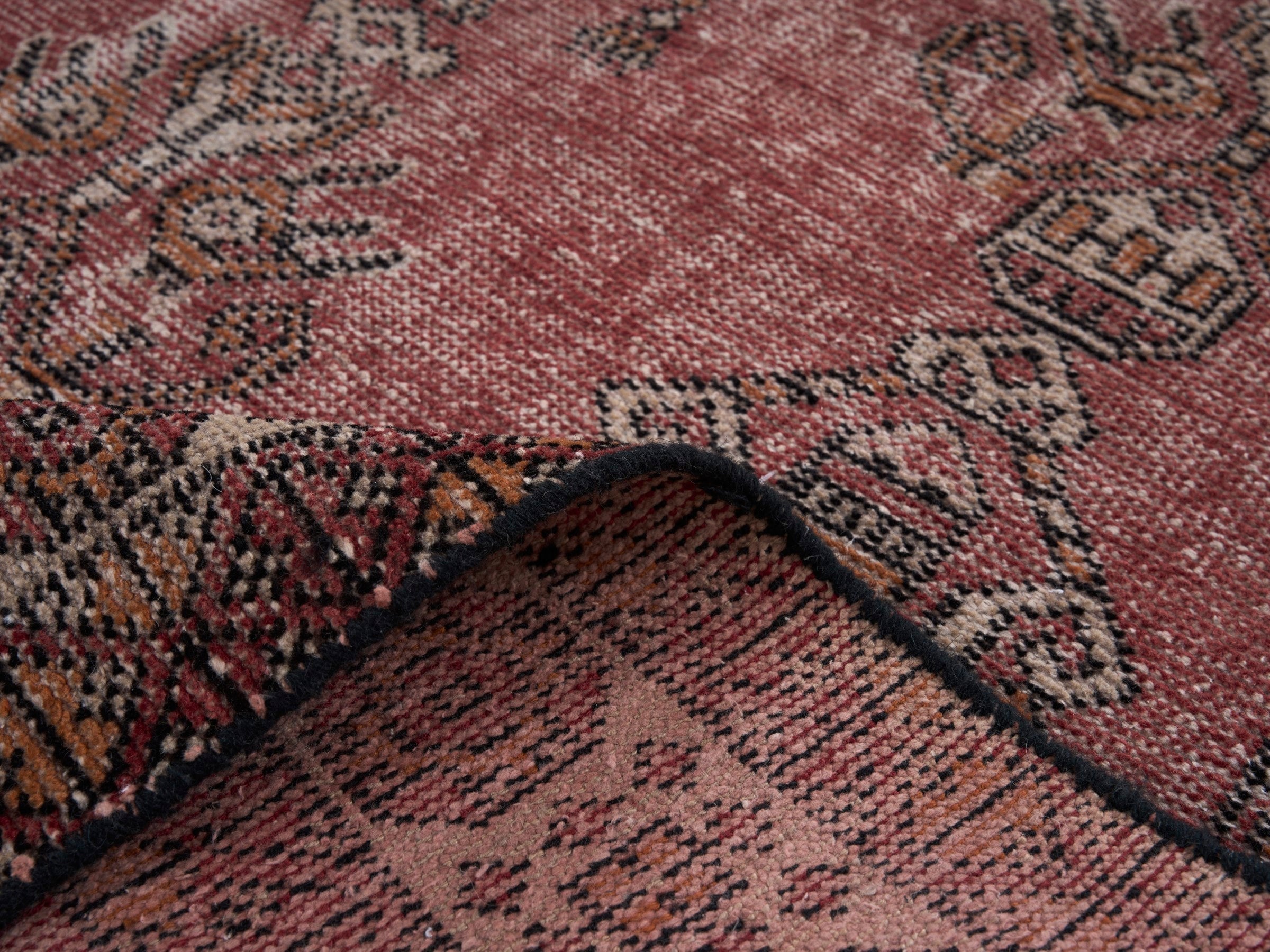 Persian Ferdos area rug in faded red and cream, view 9 of 10