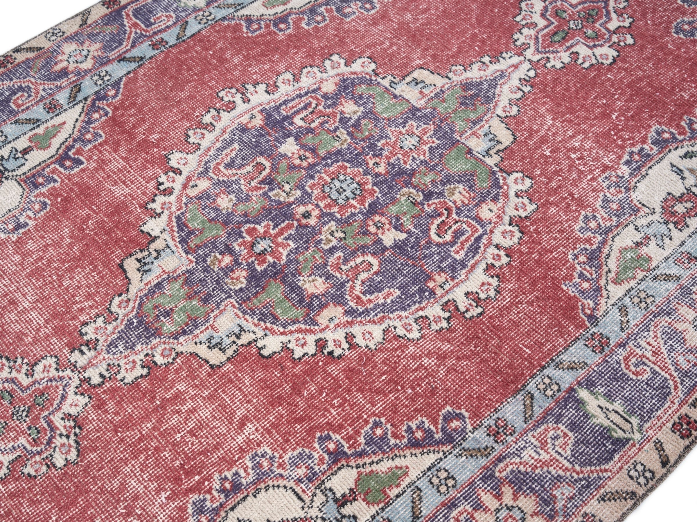 Turkish Isparta area rug in rose and navy, view 5 of 10