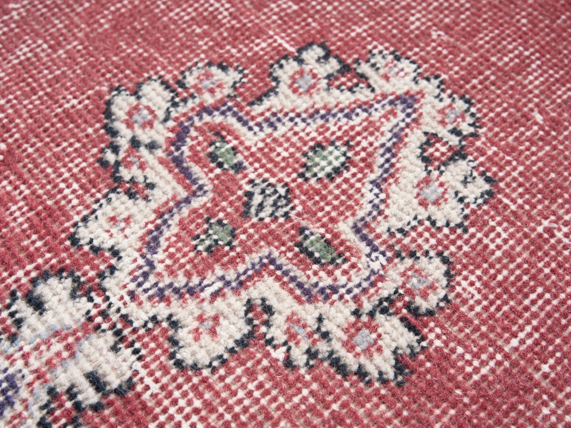 Turkish Isparta area rug in rose and navy, view 7 of 10