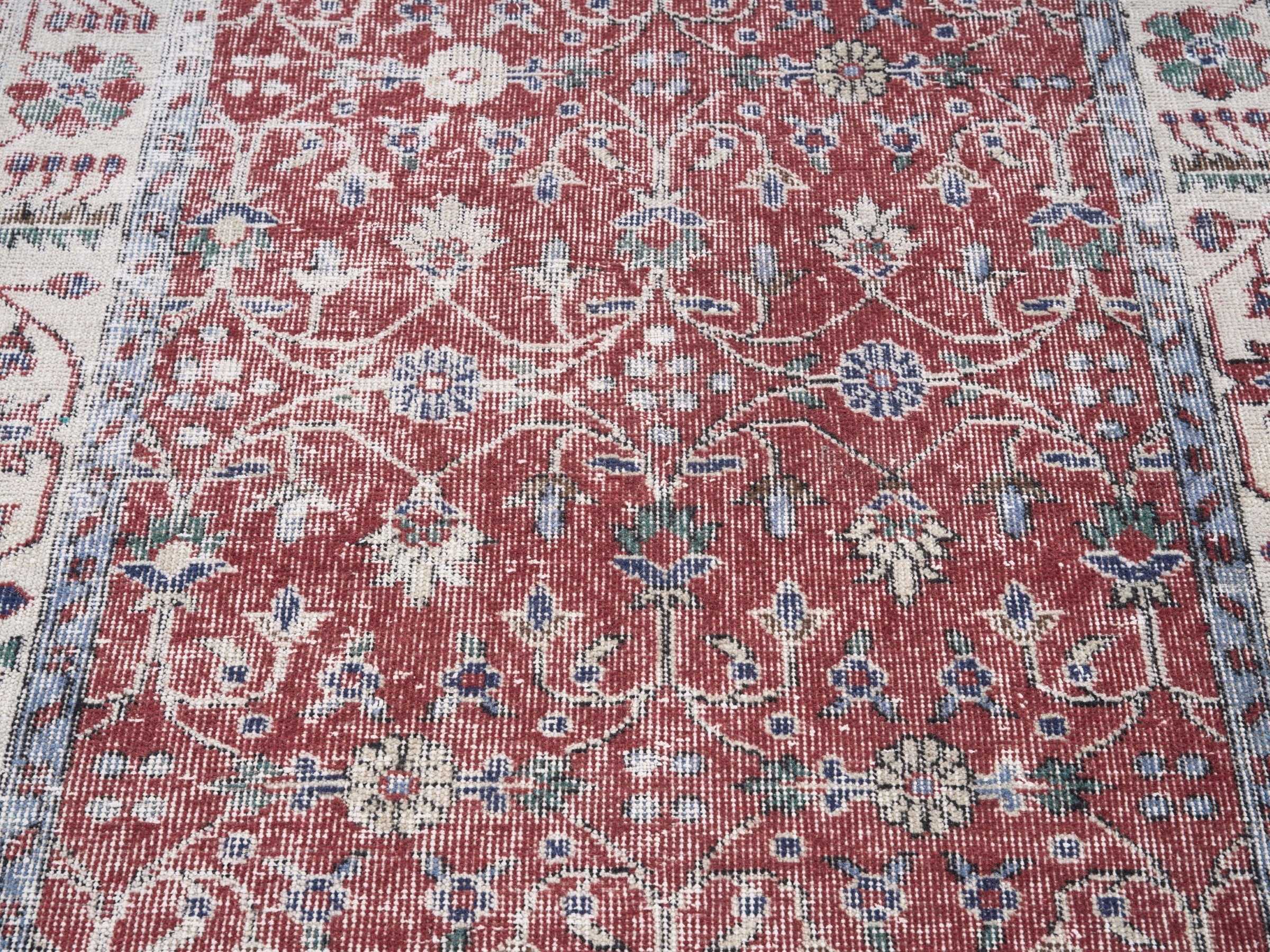 Turkish Isparta area rug in faded red and cream, view 4 of 10