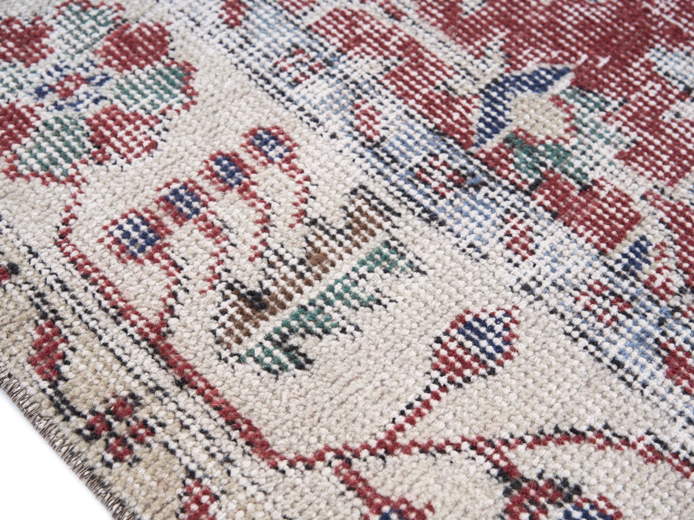 Turkish Isparta area rug in faded red and cream, view 6 of 10