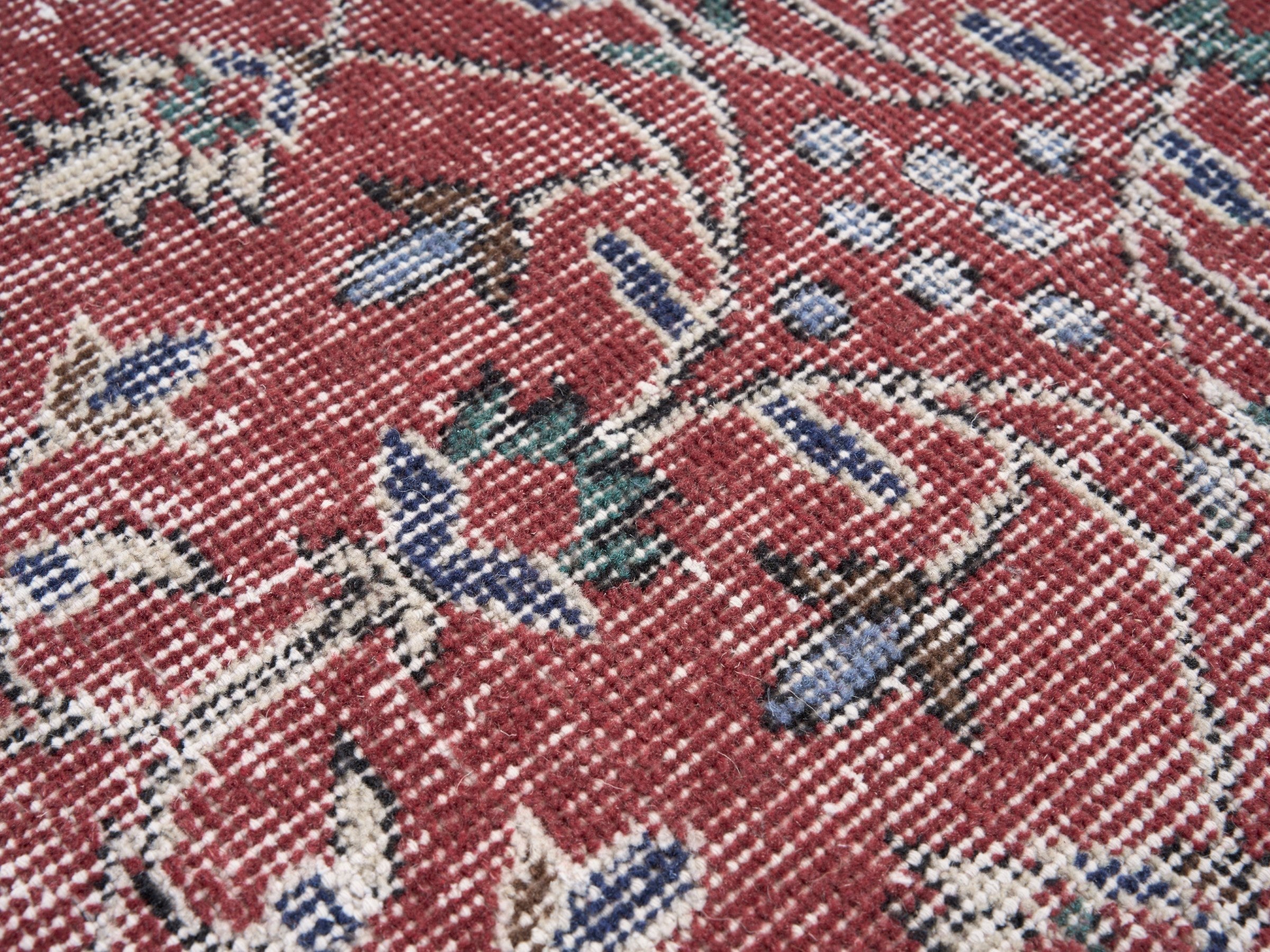 Turkish Isparta area rug in faded red and cream, view 7 of 10