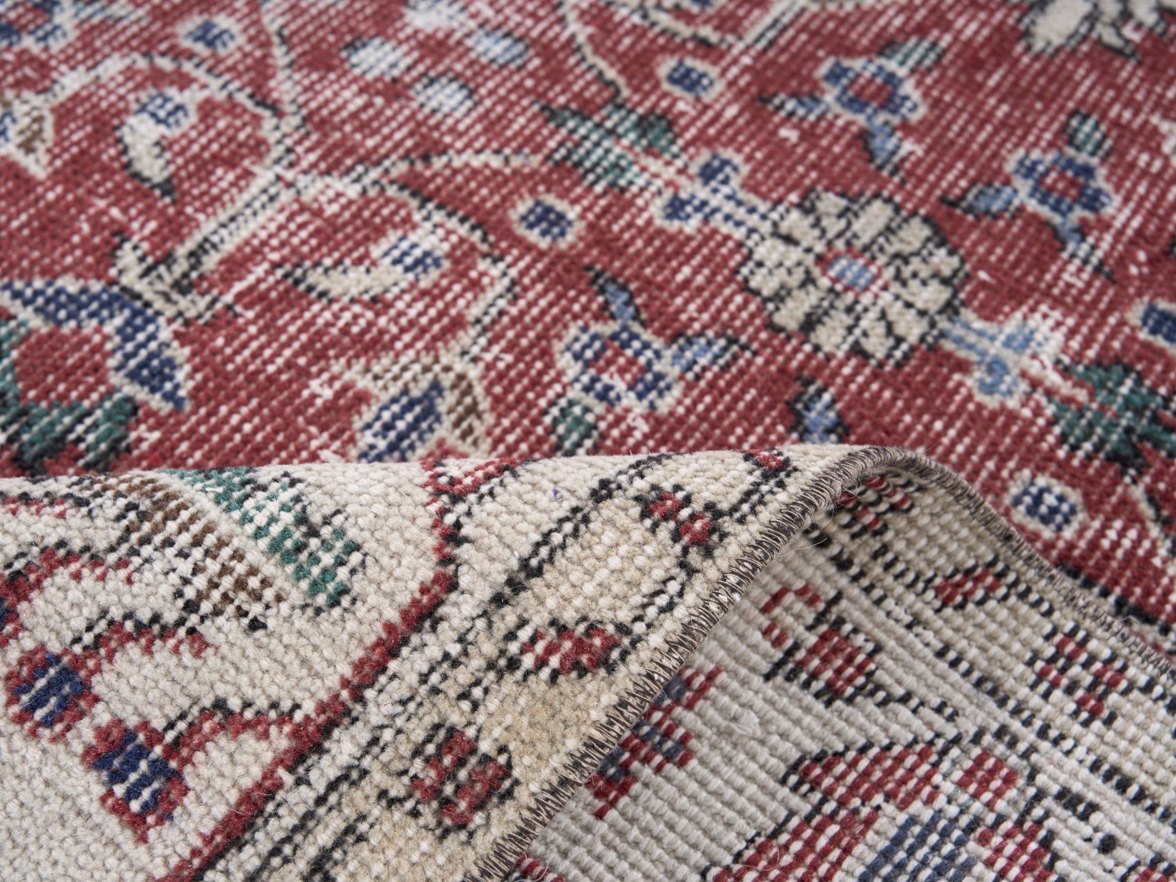 Turkish Isparta area rug in faded red and cream, view 9 of 10
