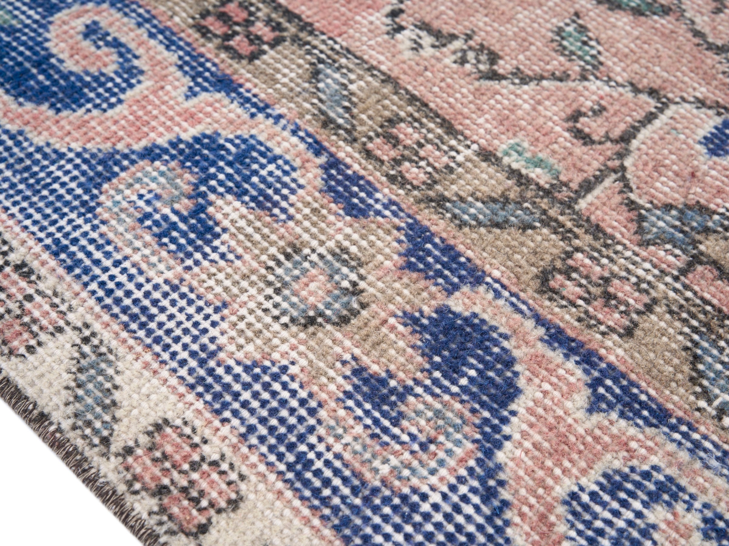 Turkish Isparta area rug in dusty rose and deep indigo, view 6 of 10