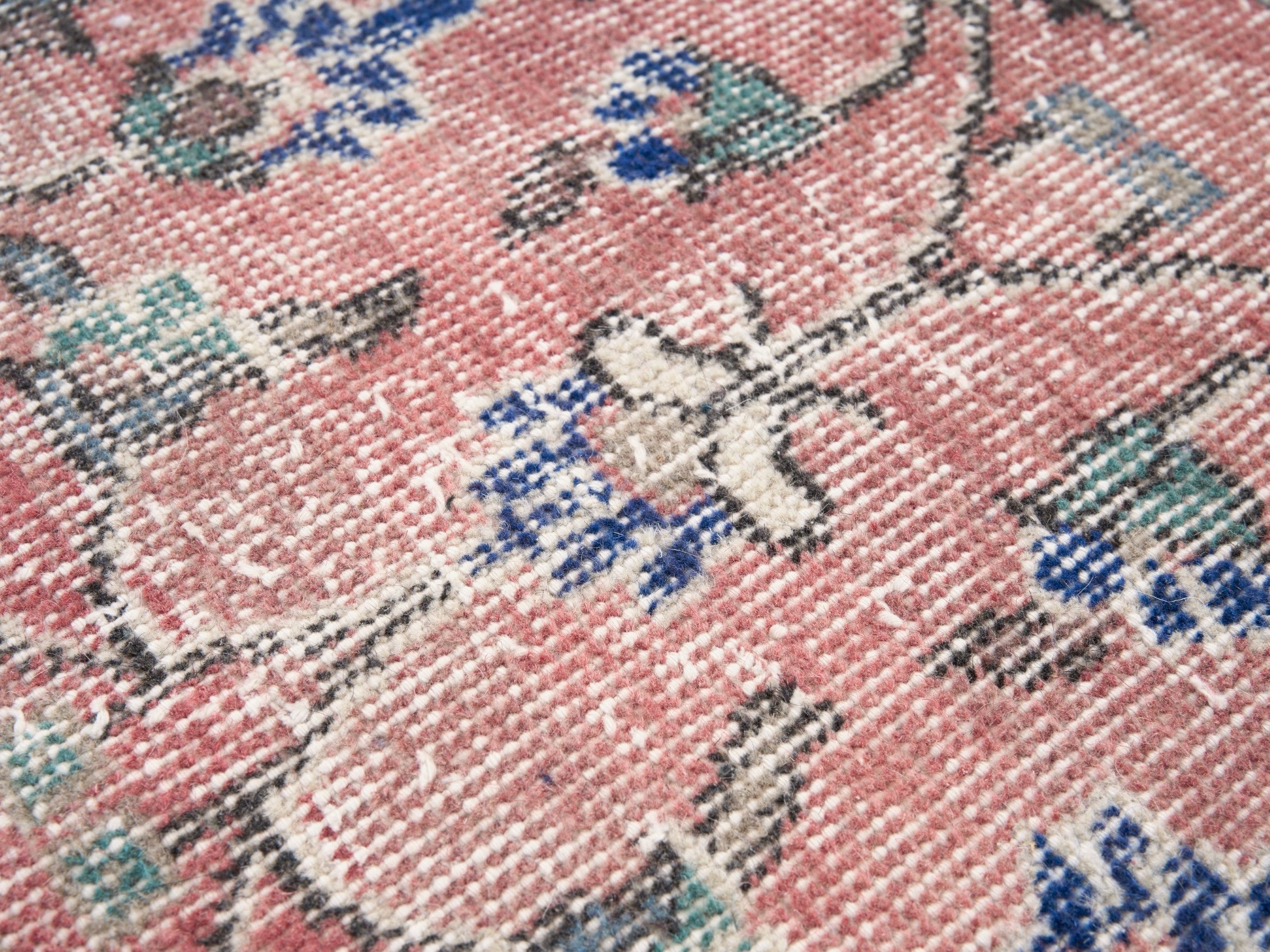 Turkish Isparta area rug in dusty rose and deep indigo, view 7 of 10