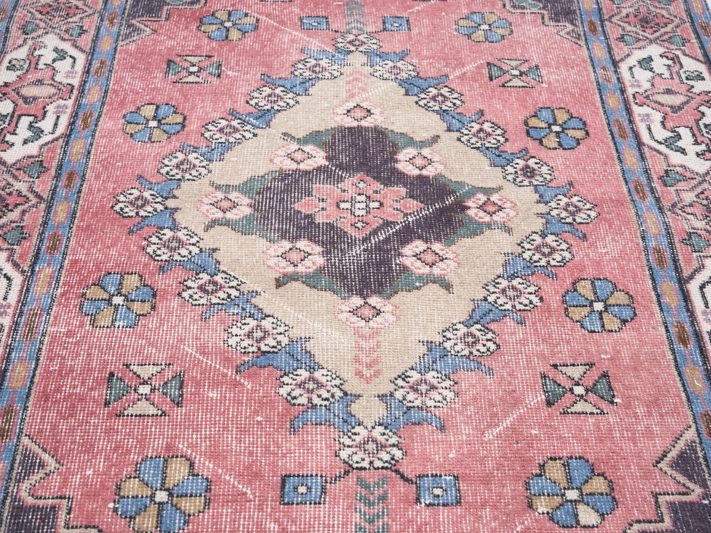 Turkish Isparta area rug in rose and navy, view 4 of 10