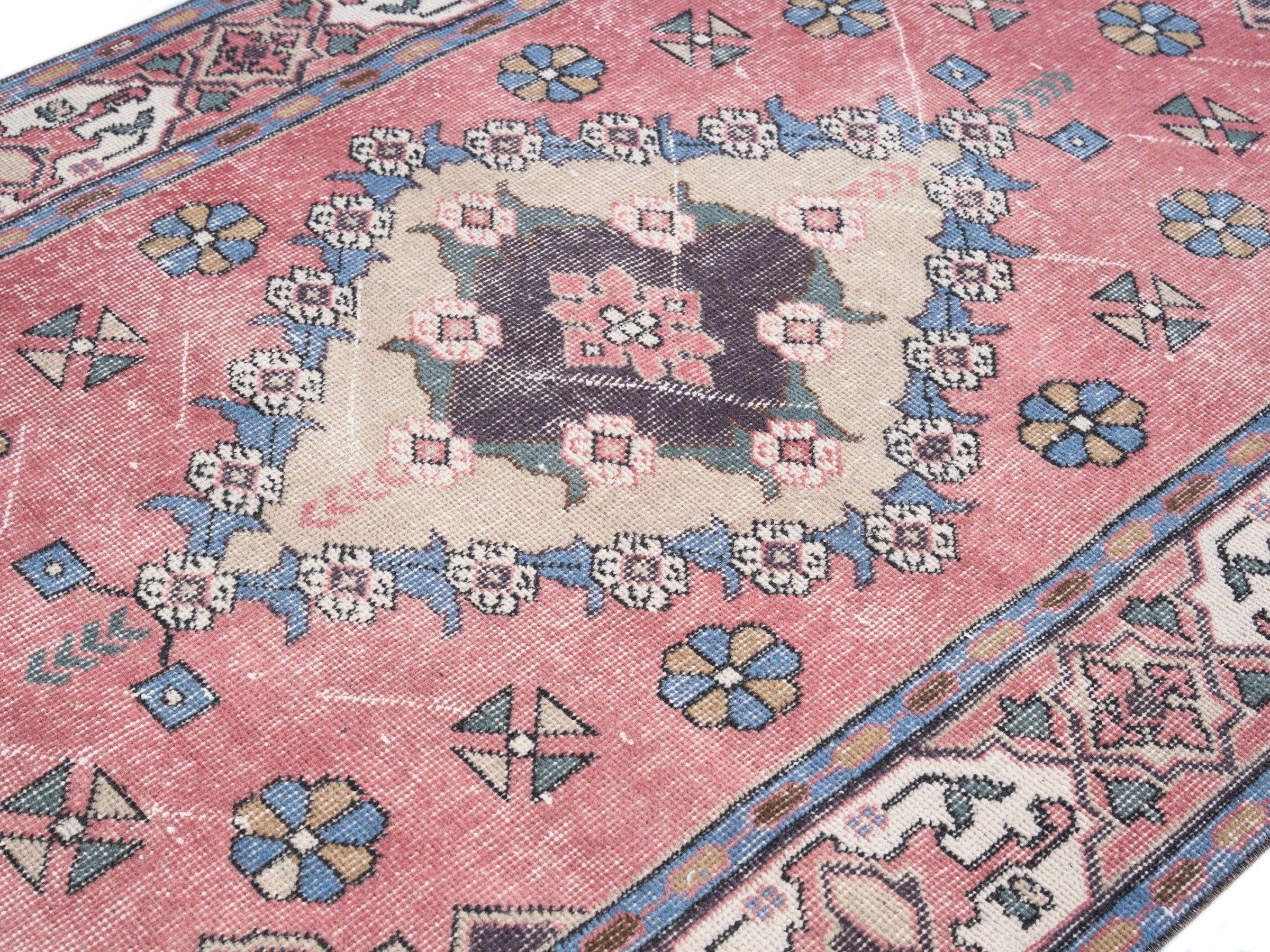Turkish Isparta area rug in rose and navy, view 5 of 10