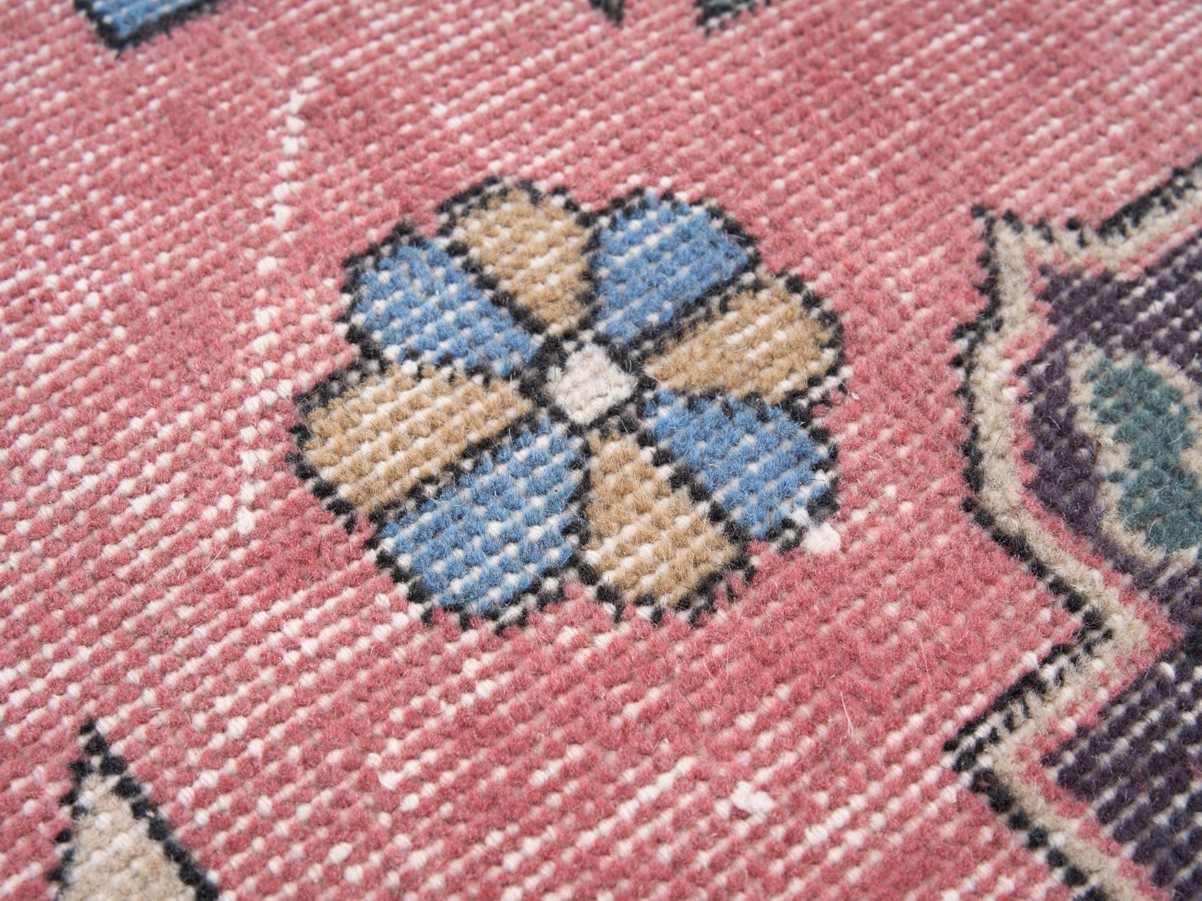 Turkish Isparta area rug in rose and navy, view 7 of 10