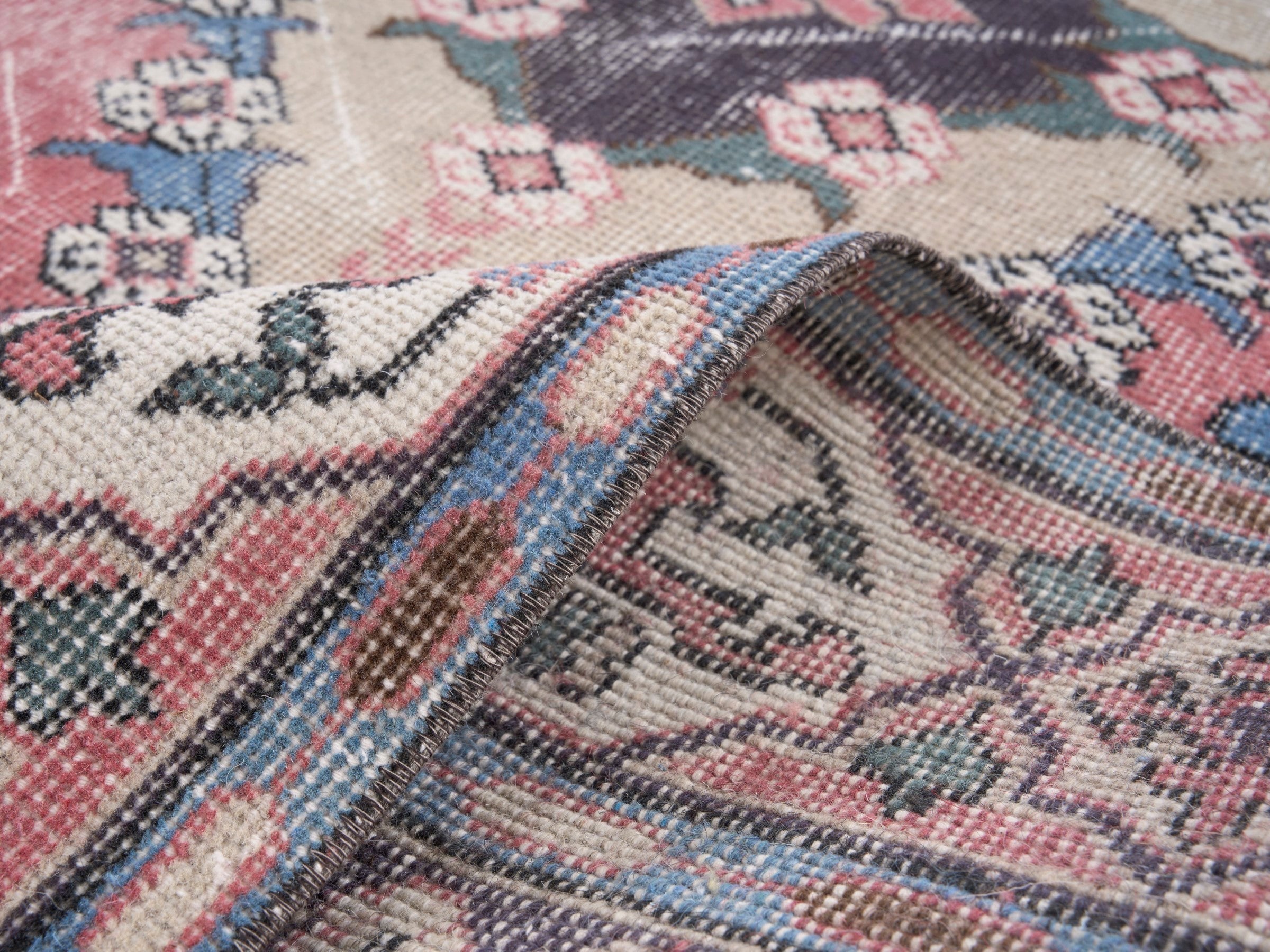 Turkish Isparta area rug in rose and navy, view 9 of 10