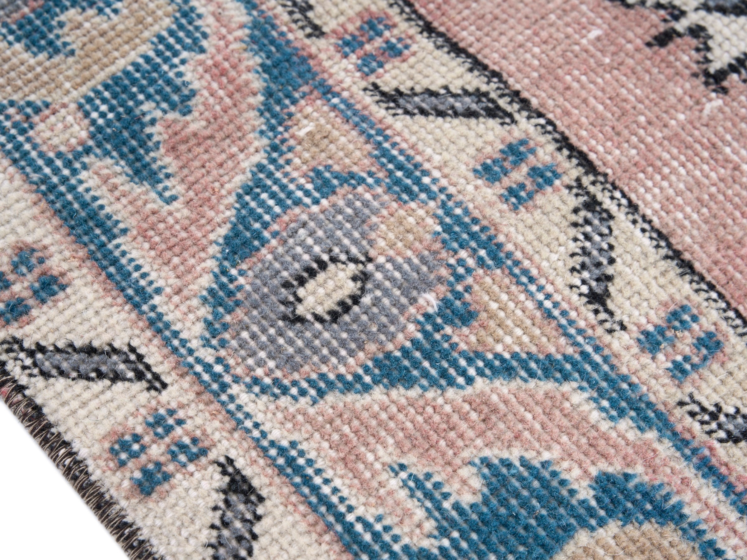 Turkish Isparta area rug in muted pink and denim, view 6 of 10