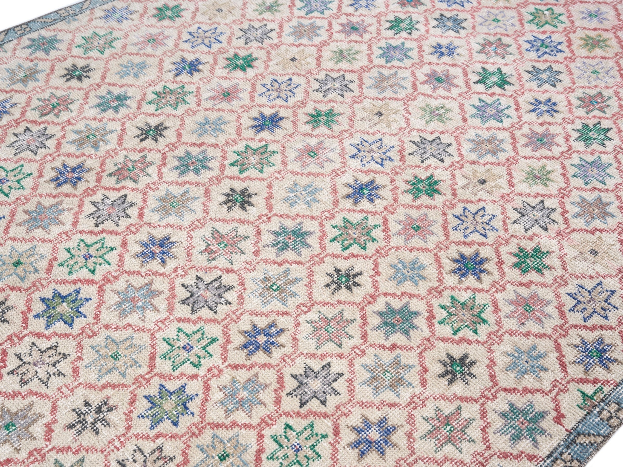 Turkish Isparta area rug in muted pink and dusty blue, view 5 of 10