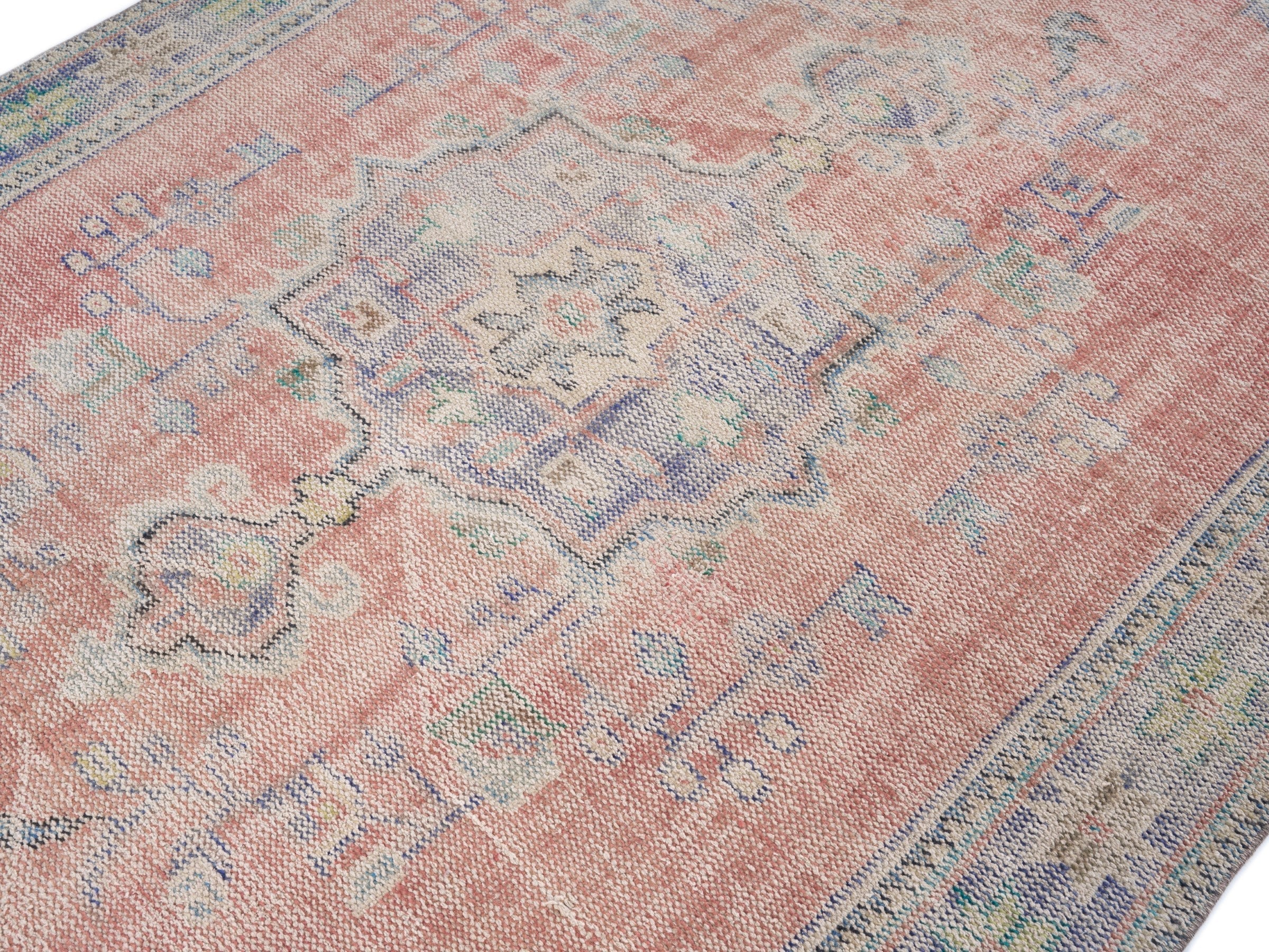 Turkish Manisa area rug in muted pink and slate blue, view 5 of 10