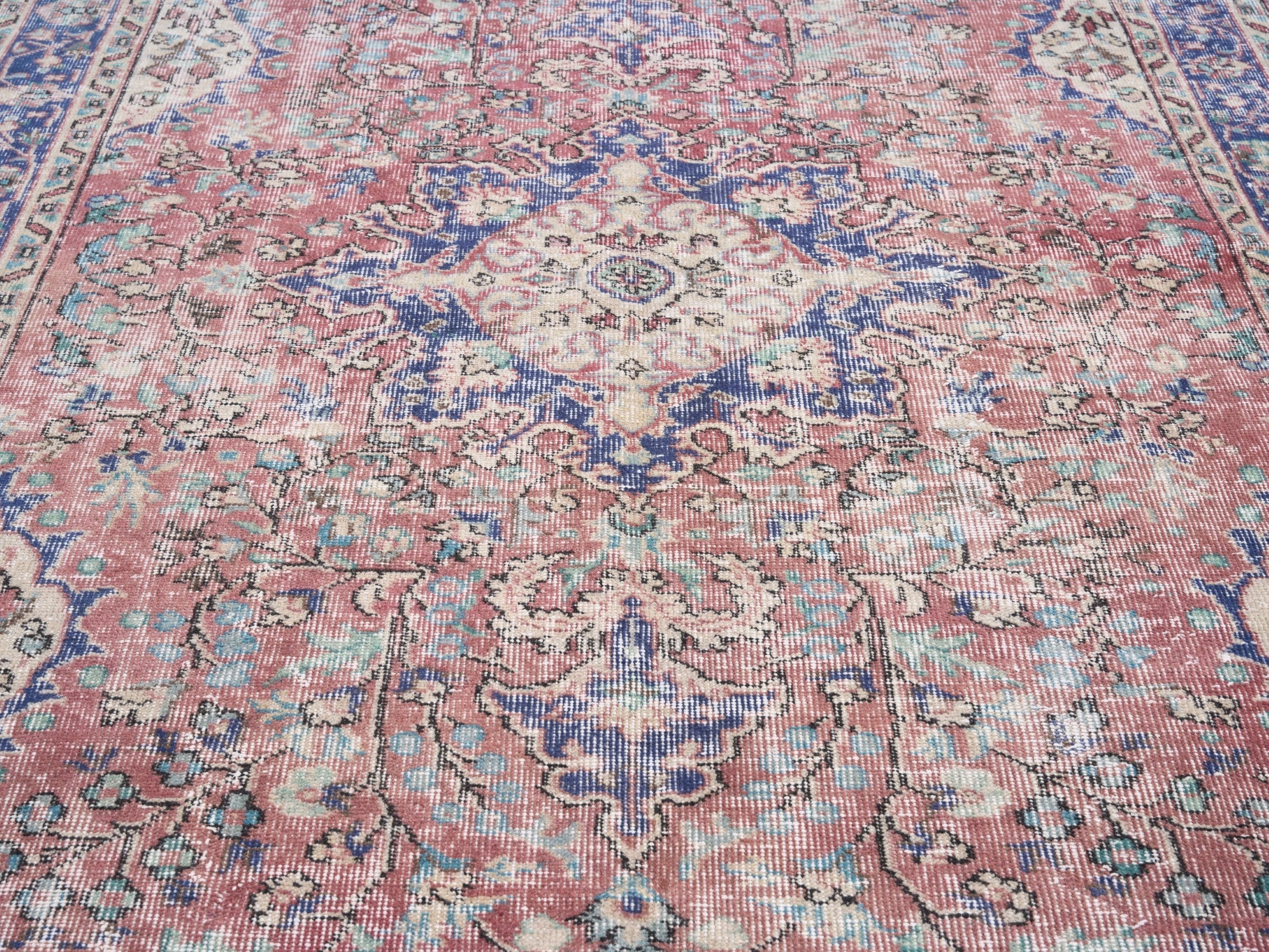Turkish Isparta area rug in faded red and deep indigo, view 4 of 10