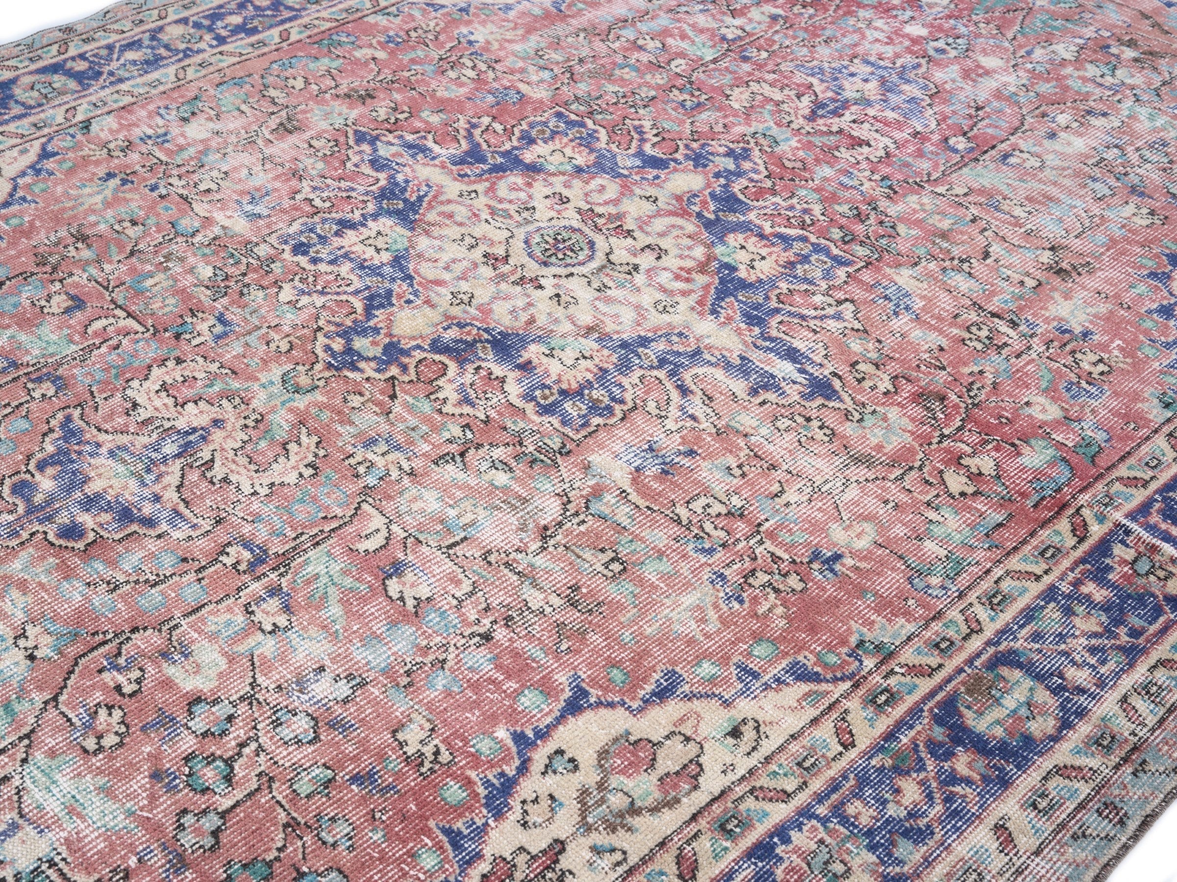 Turkish Isparta area rug in faded red and deep indigo, view 5 of 10