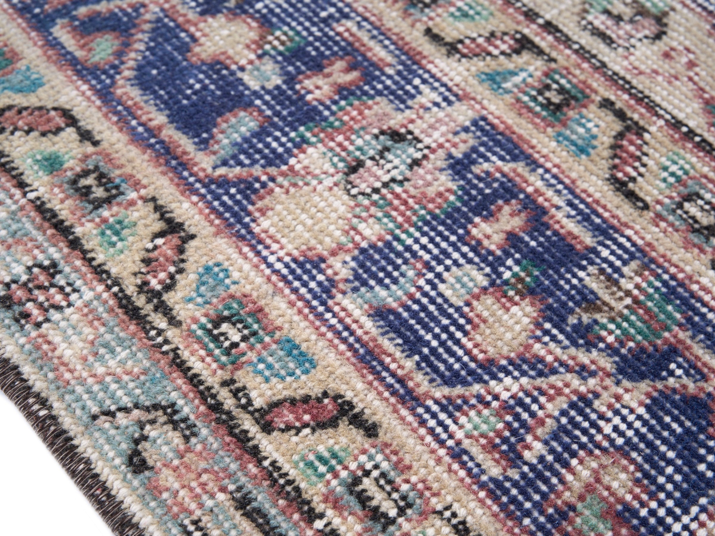 Turkish Isparta area rug in faded red and deep indigo, view 6 of 10