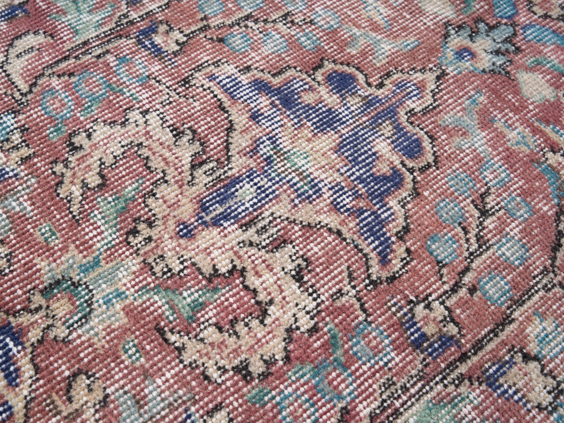 Turkish Isparta area rug in faded red and deep indigo, view 7 of 10