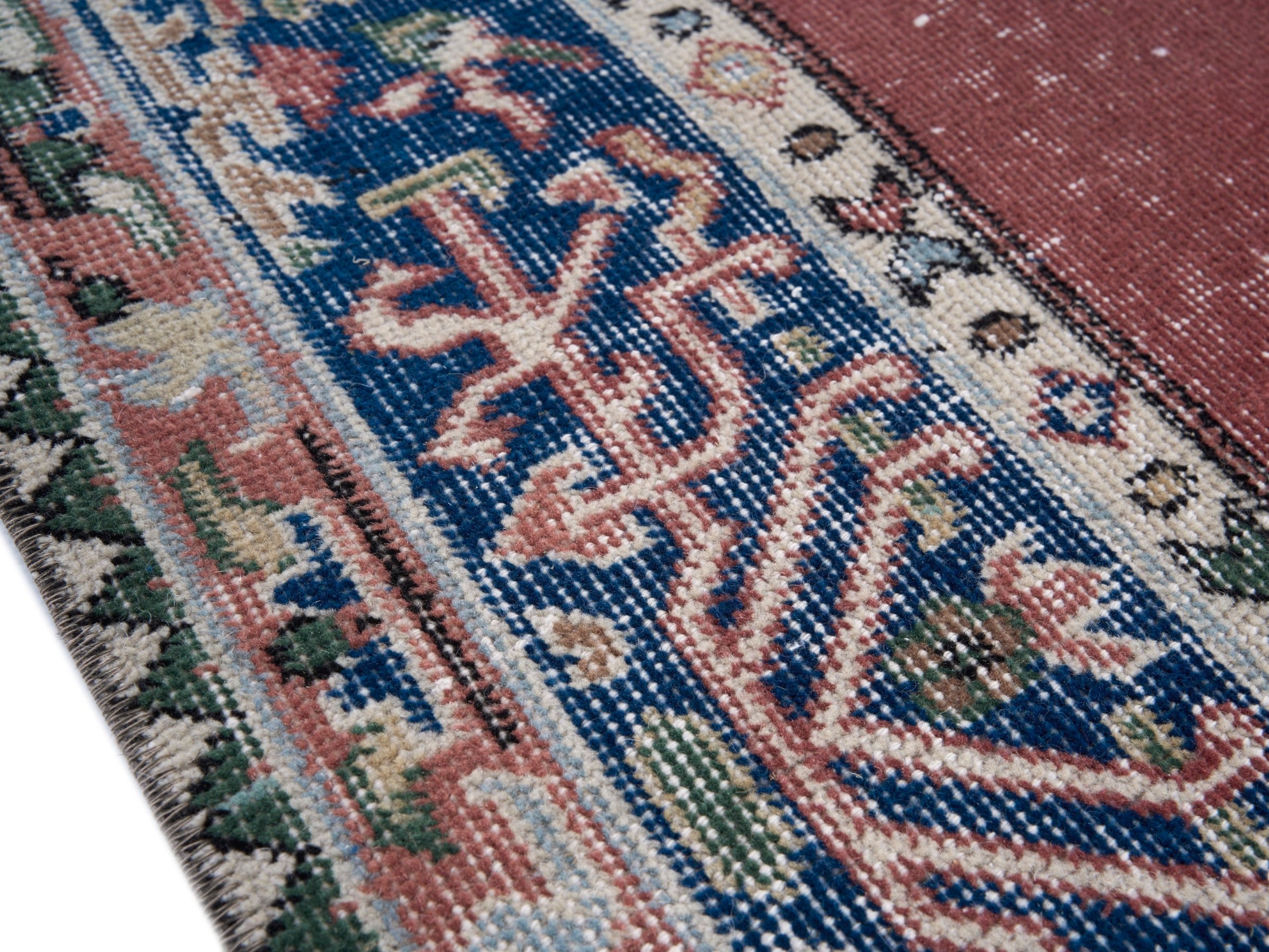 Turkish Isparta area rug in dusty rose and navy, view 6 of 10