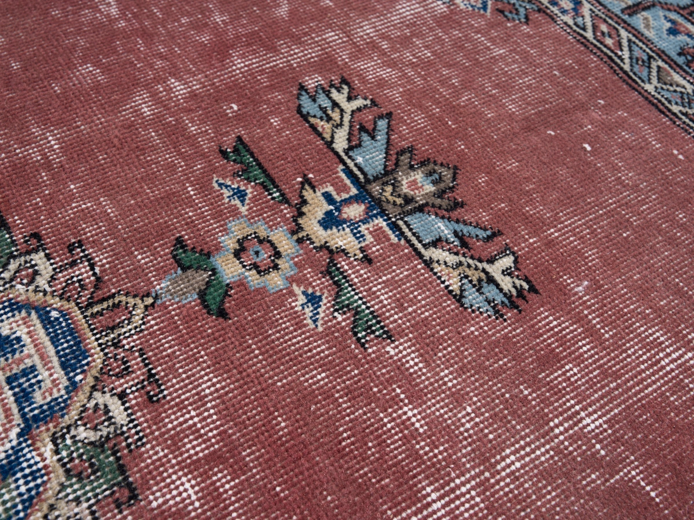 Turkish Isparta area rug in dusty rose and navy, view 7 of 10