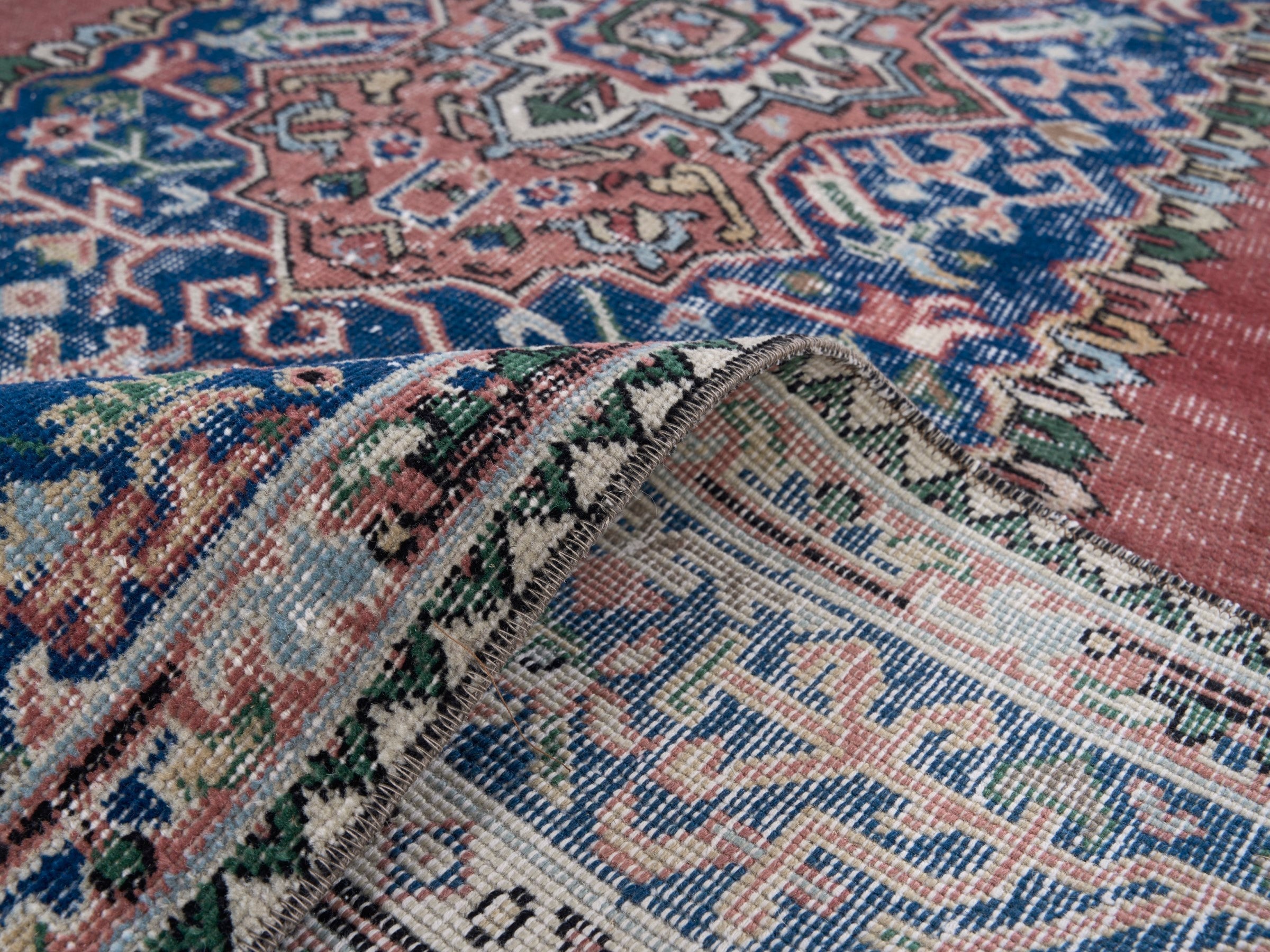 Turkish Isparta area rug in dusty rose and navy, view 9 of 10