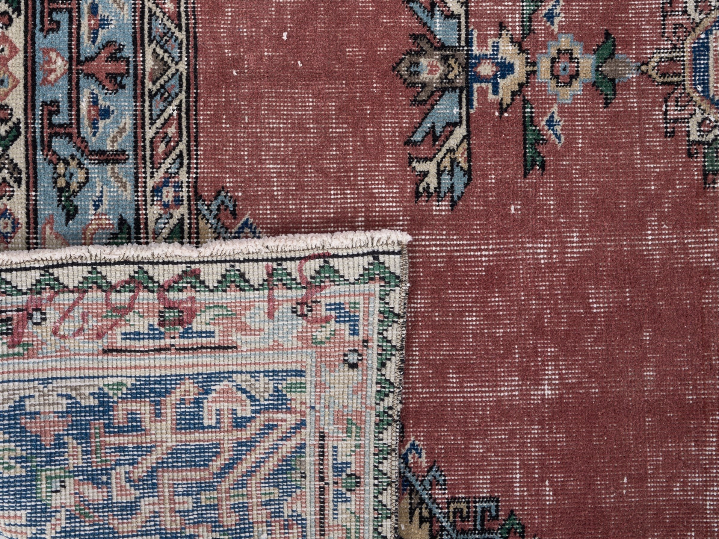 Turkish Isparta area rug in dusty rose and navy, view 10 of 10