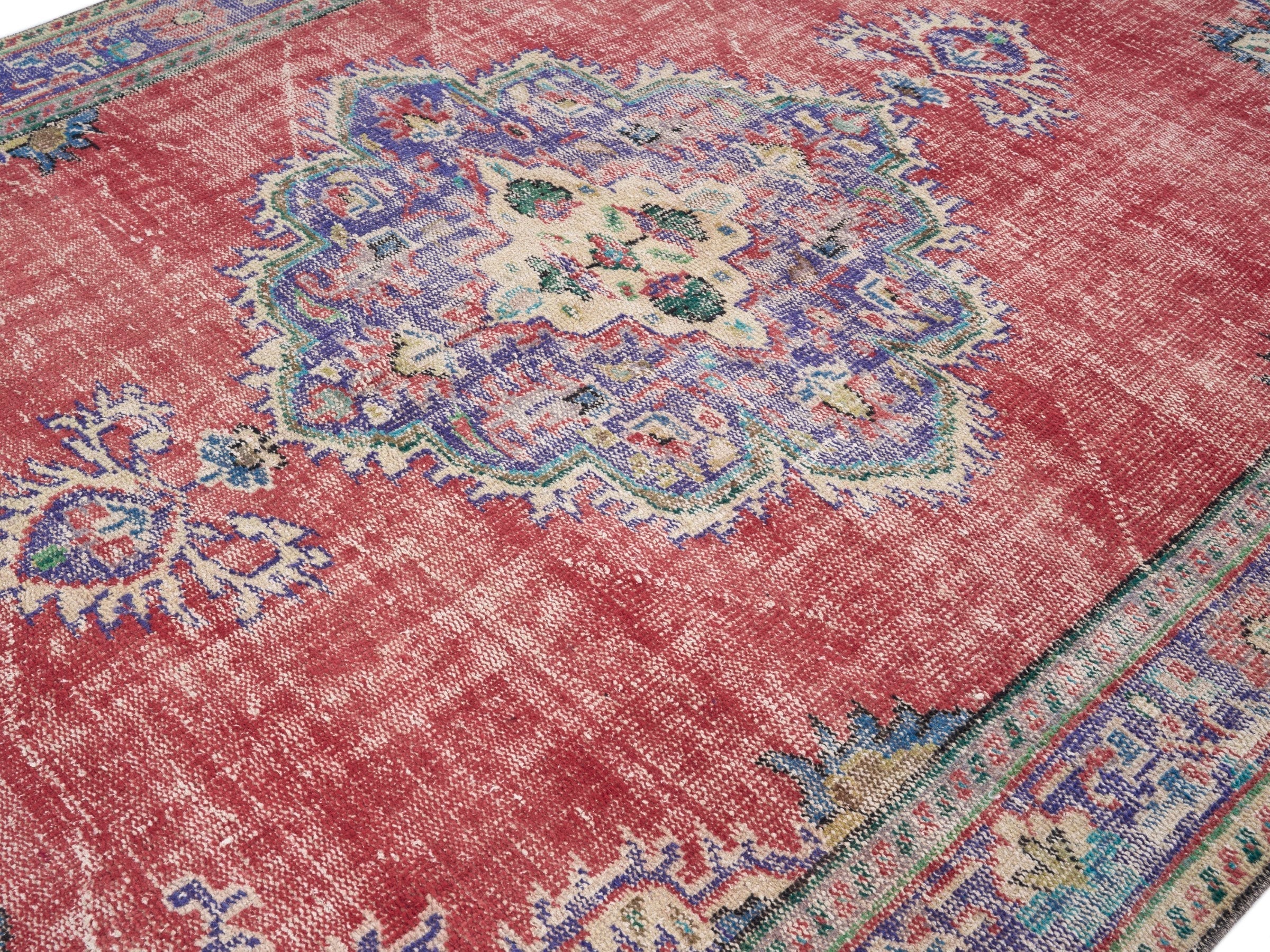 Turkish Manisa area rug in faded red and dark blue, view 5 of 10