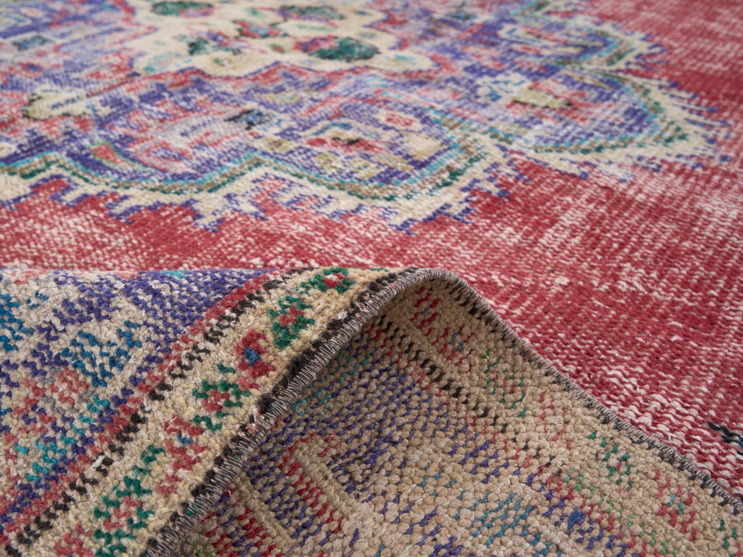 Turkish Manisa area rug in faded red and dark blue, view 9 of 10