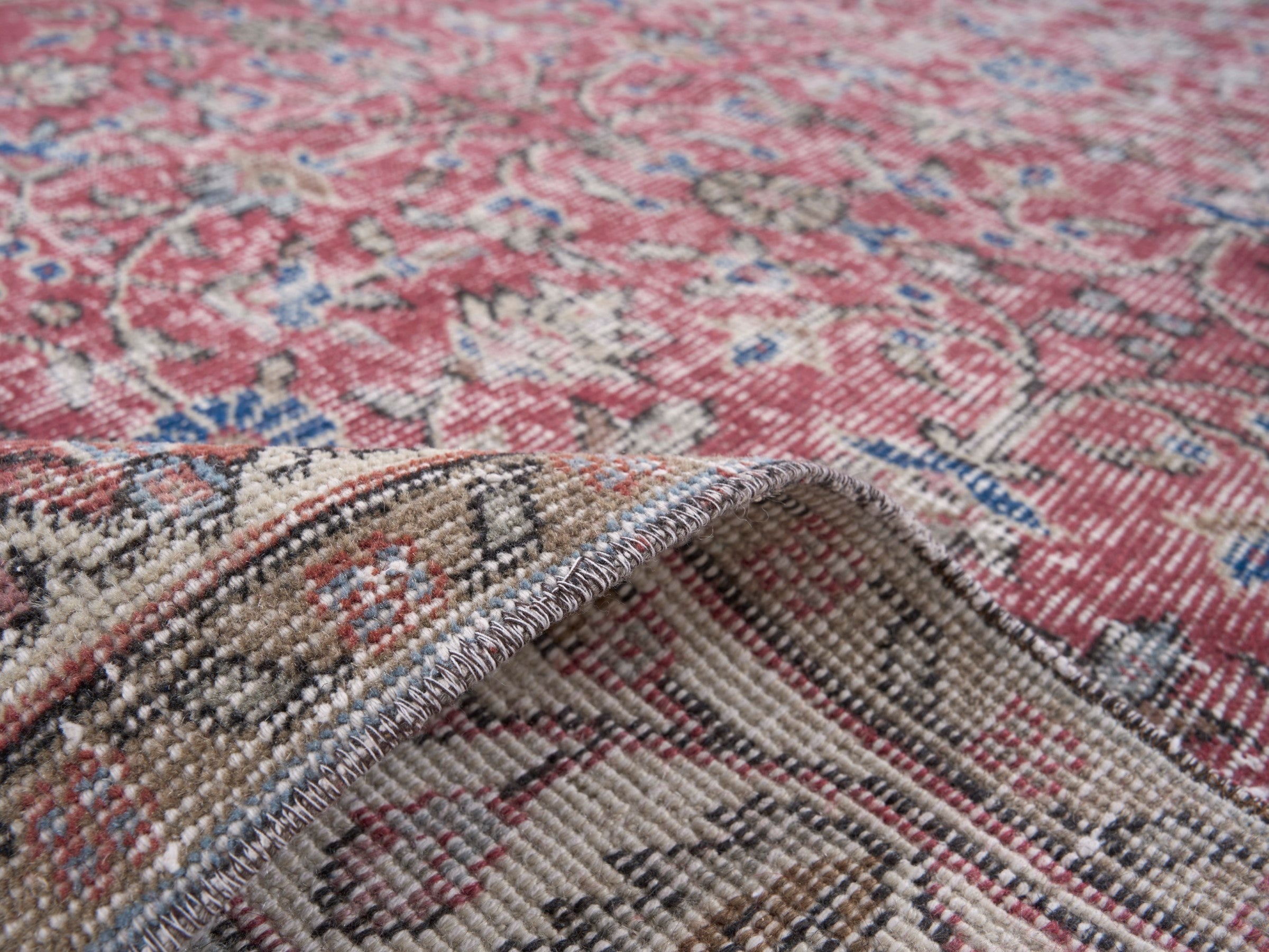 Turkish Isparta area rug in faded red and cream, view 9 of 10