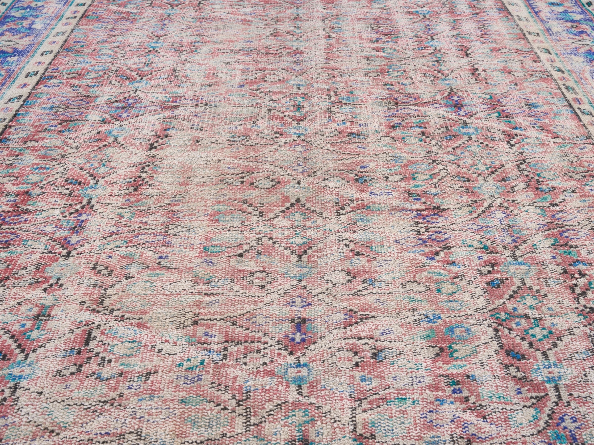 Turkish Manisa area rug in muted pink and navy, view 4 of 10