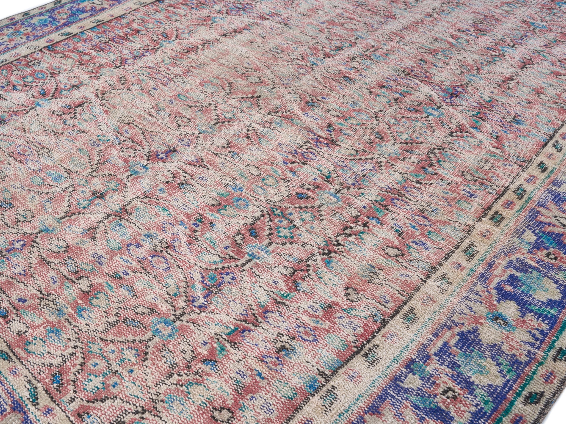 Turkish Manisa area rug in muted pink and navy, view 5 of 10