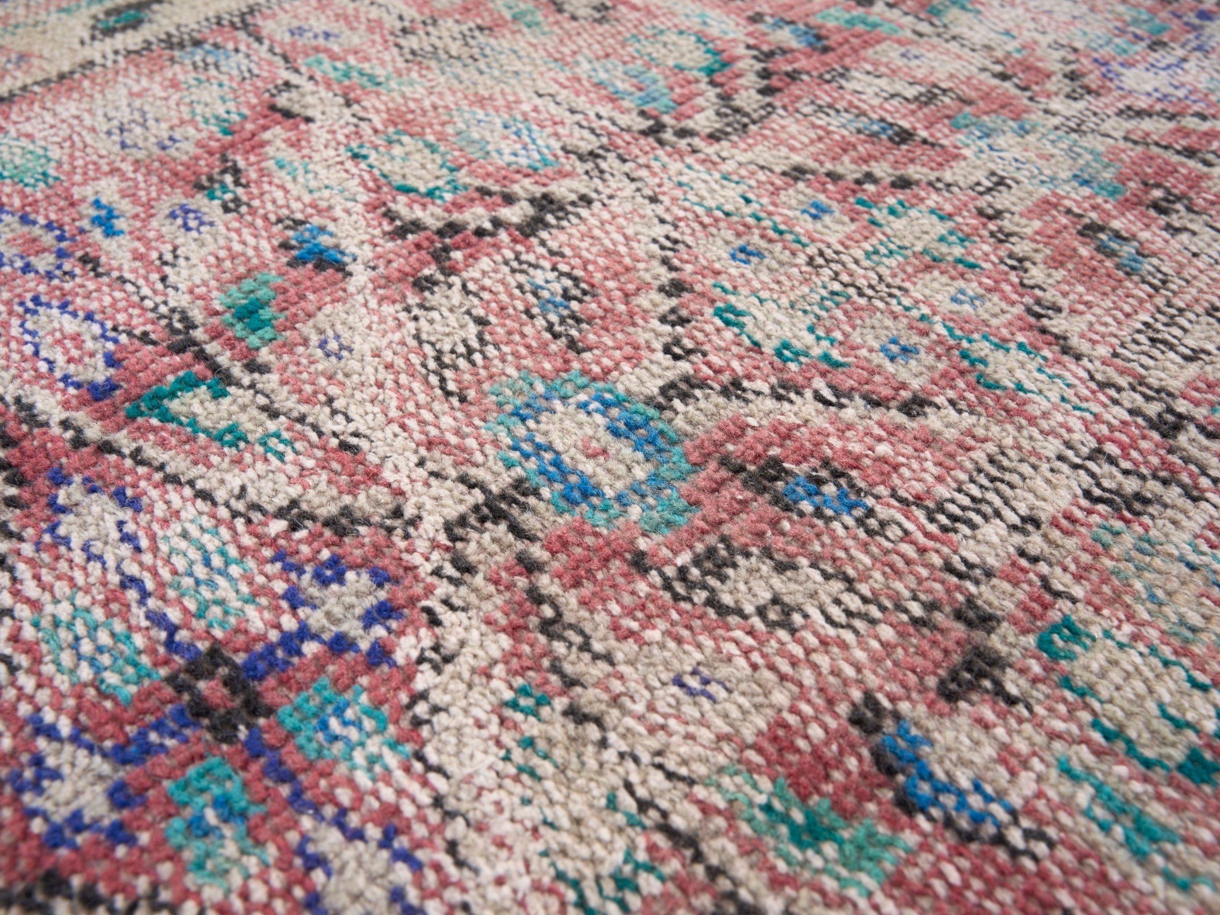 Turkish Manisa area rug in muted pink and navy, view 7 of 10