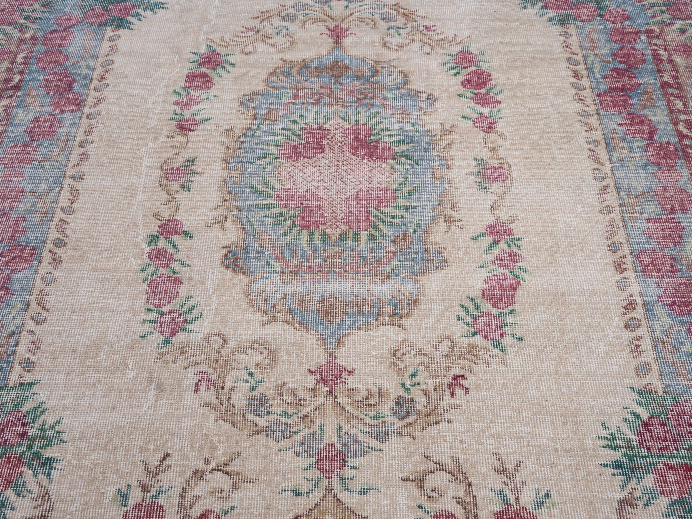 Turkish Isparta area rug in cream and faded red, view 4 of 10