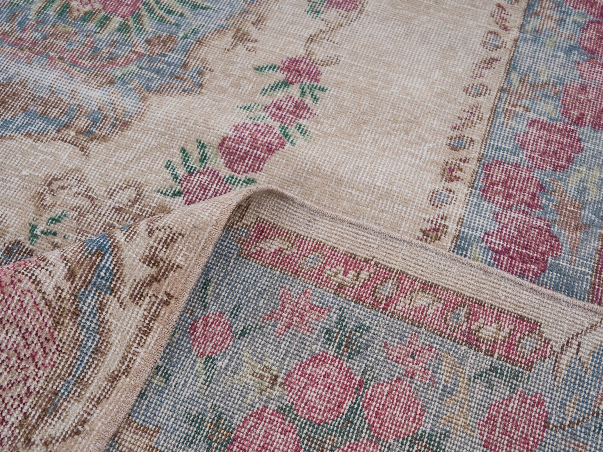 Turkish Isparta area rug in cream and faded red, view 9 of 10