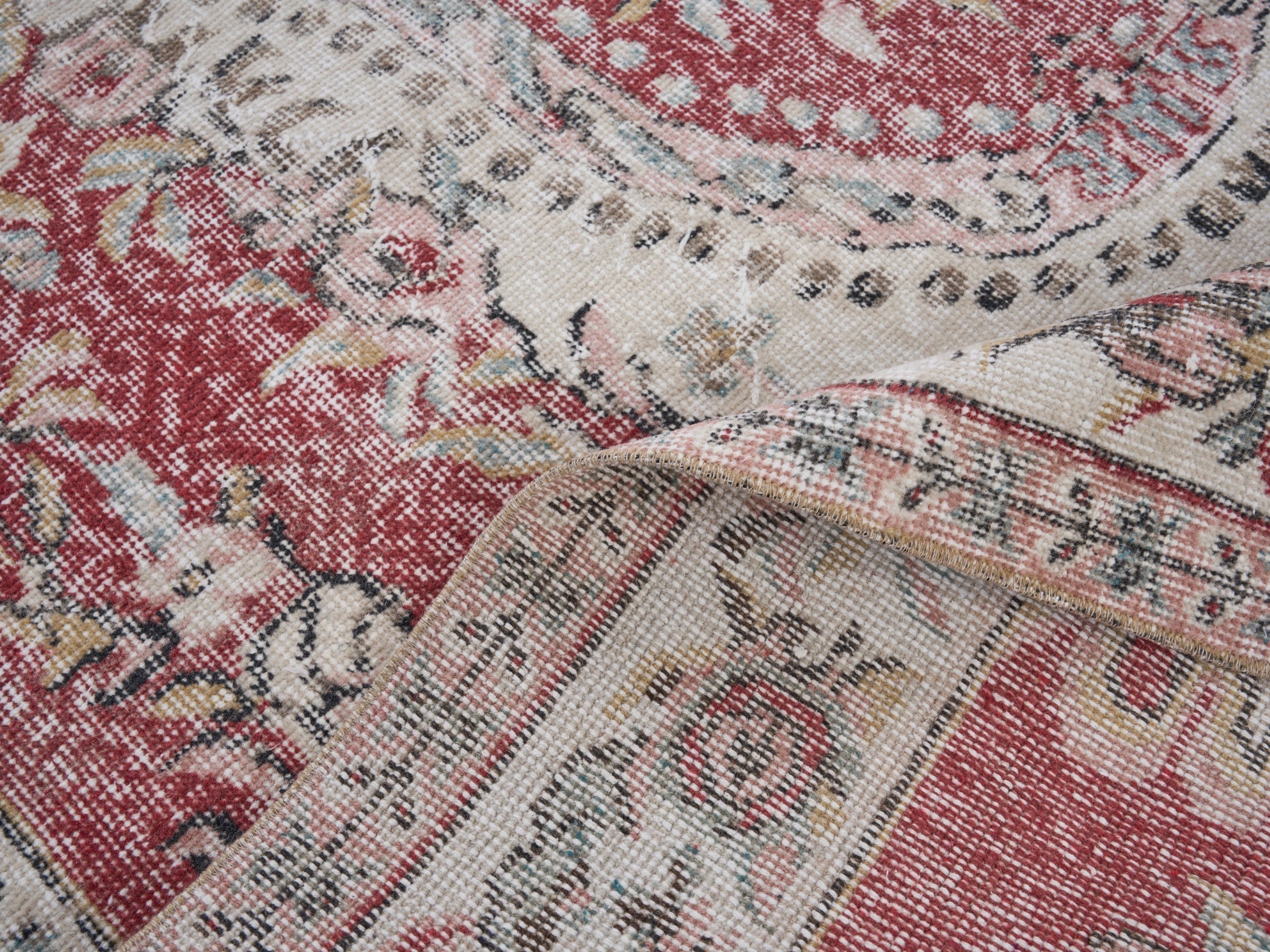 Turkish Isparta area rug in faded red and cream, view 9 of 10