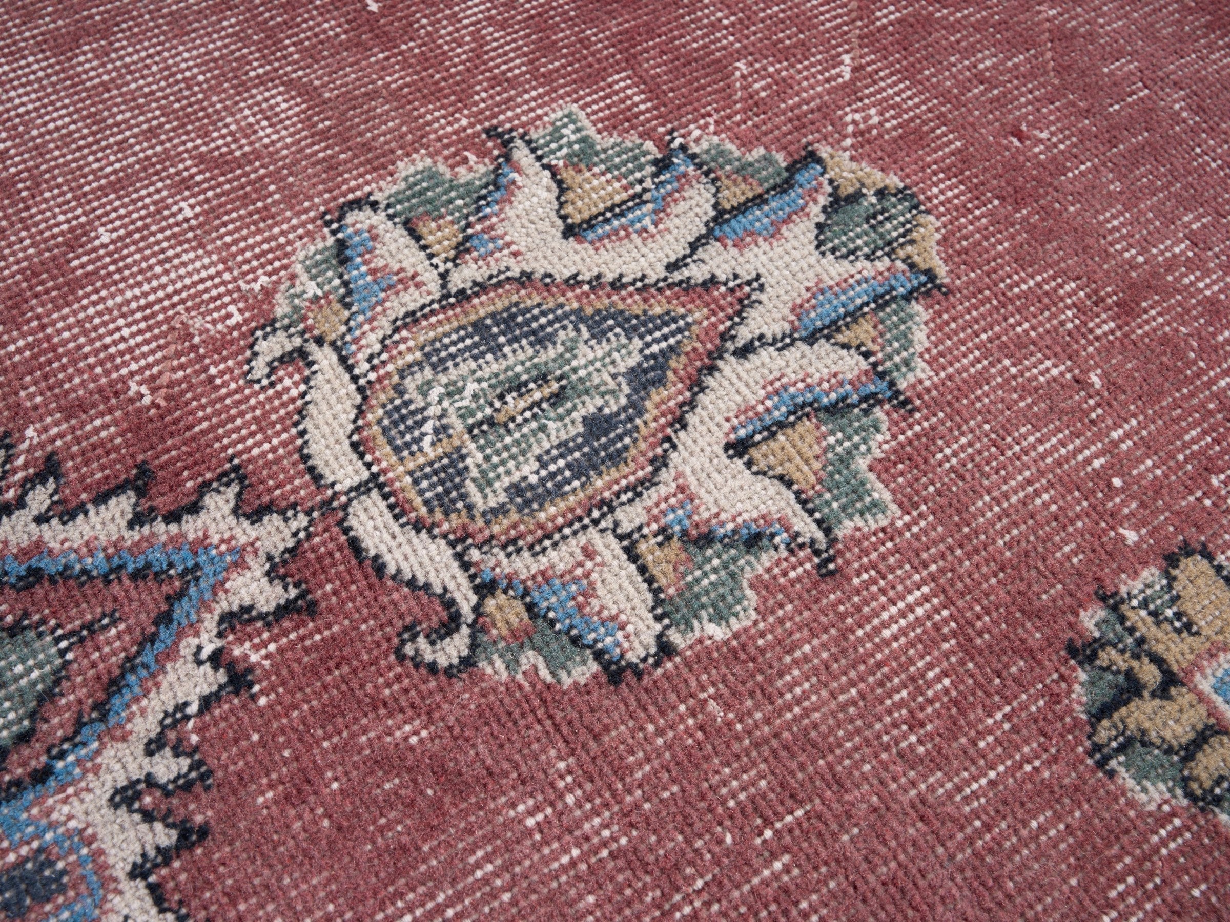 Turkish Isparta area rug in dusty rose and navy, view 7 of 10
