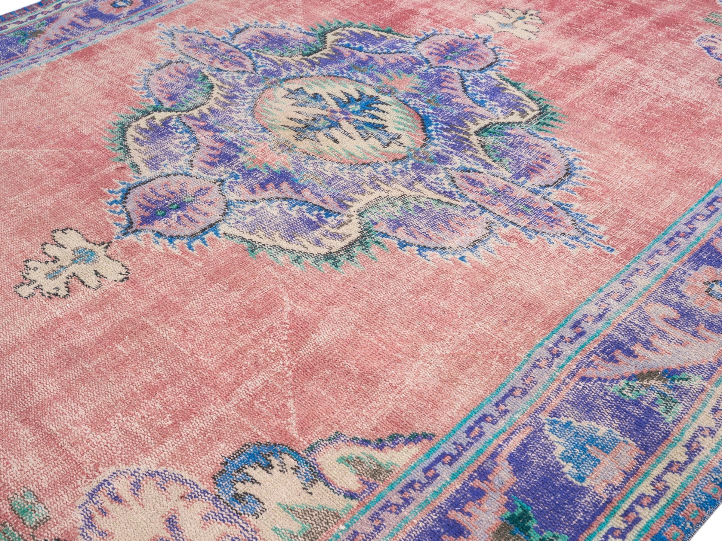 Turkish Manisa area rug in dusty rose and plum, view 5 of 10