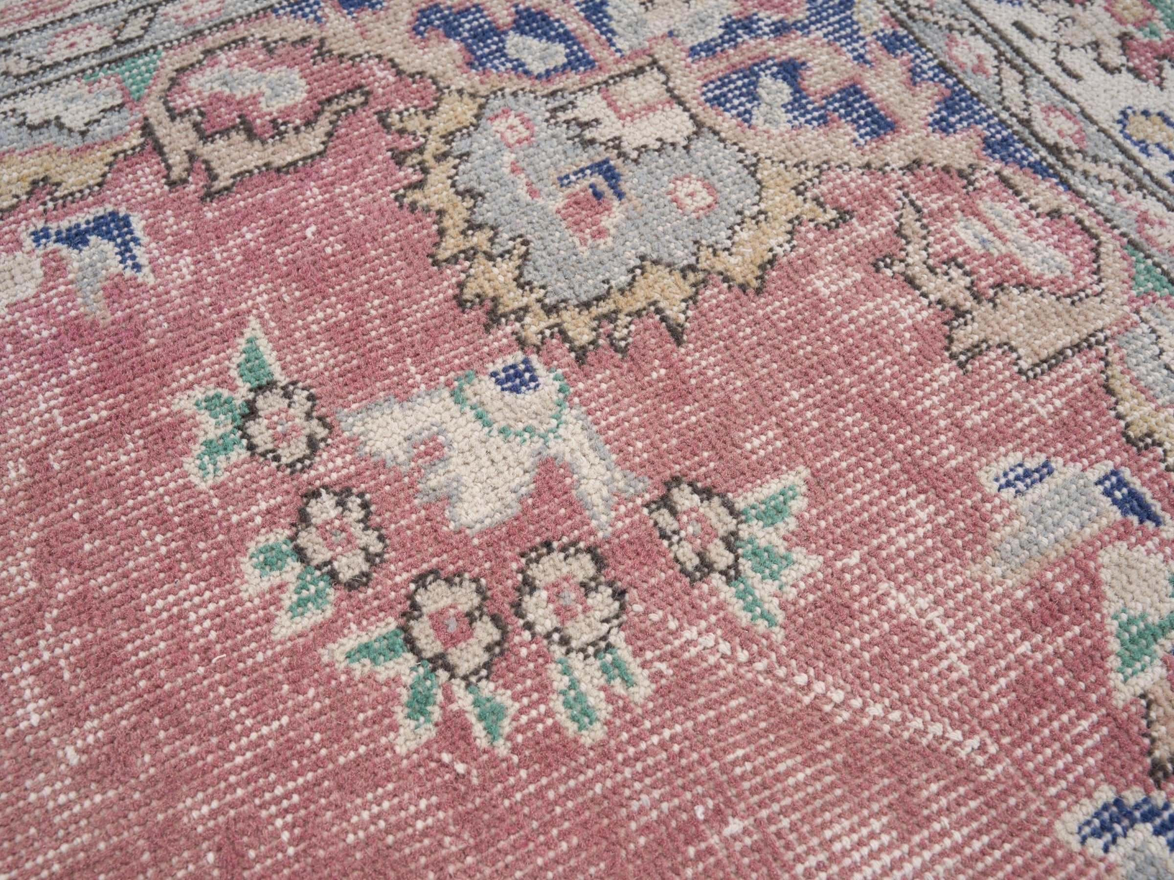 Turkish Isparta area rug in muted pink and off-white, view 7 of 10