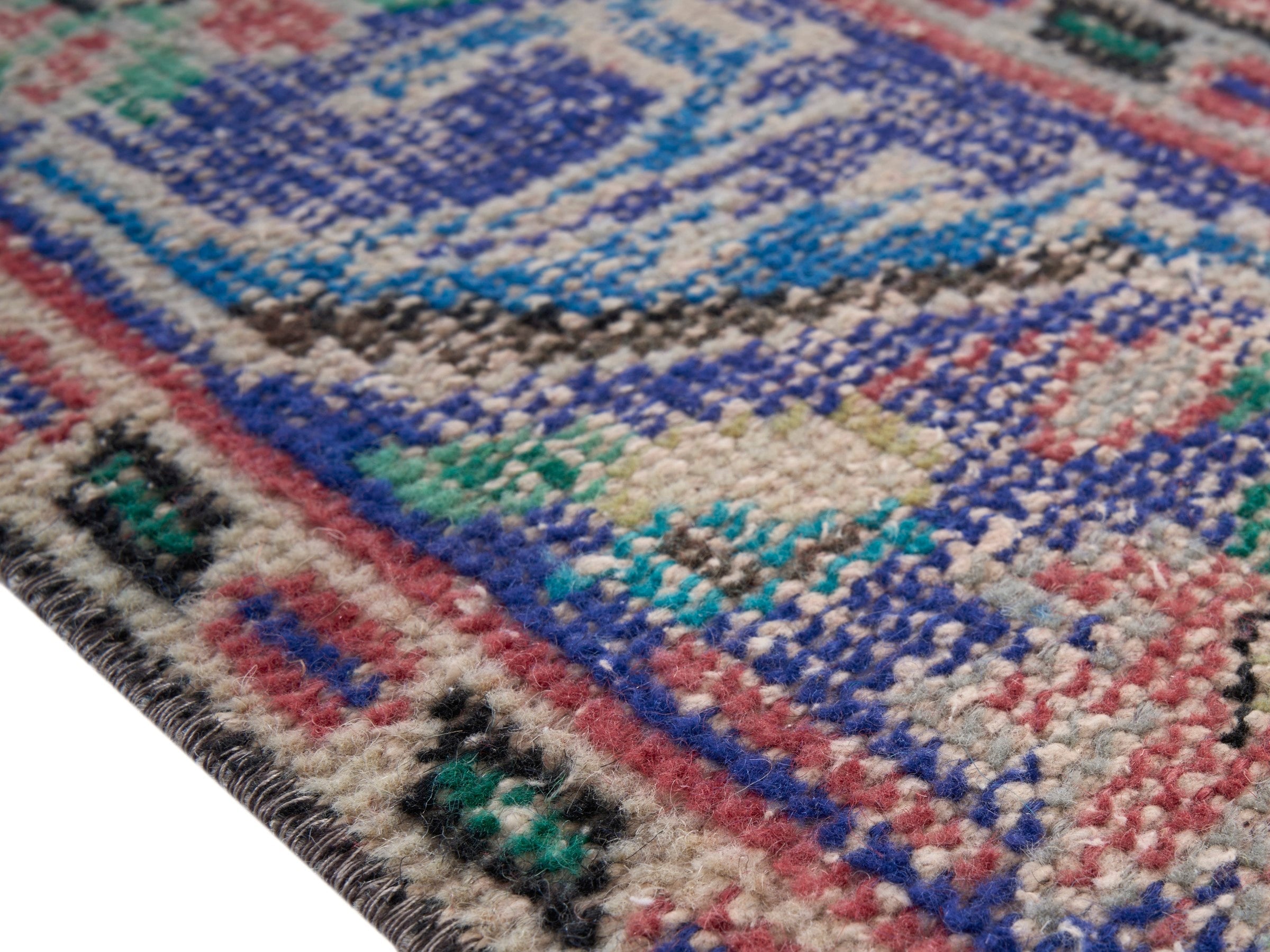 Turkish Manisa area rug in faded red and navy, view 6 of 10