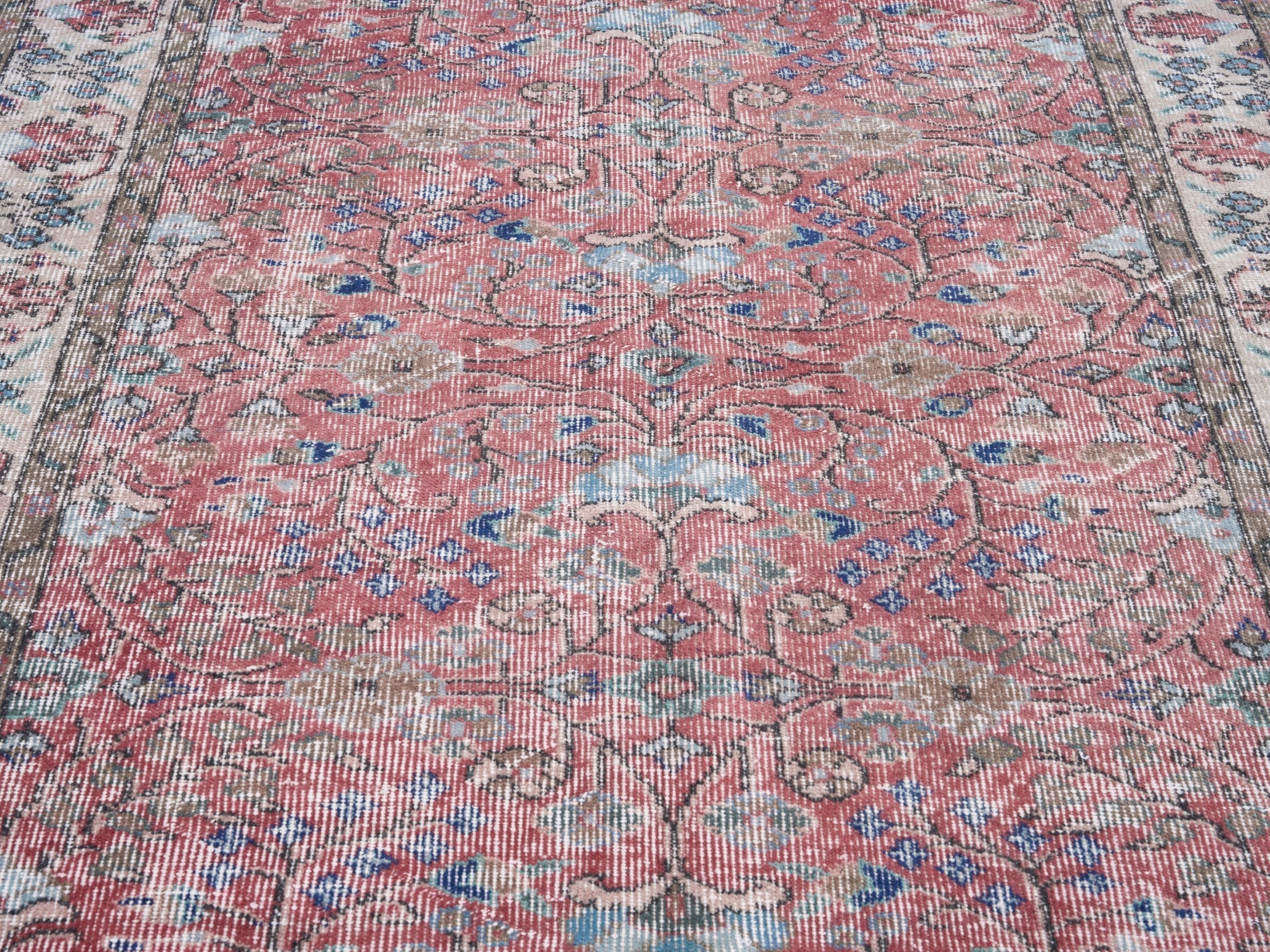 Turkish Isparta area rug in faded red and muted pink, view 4 of 10
