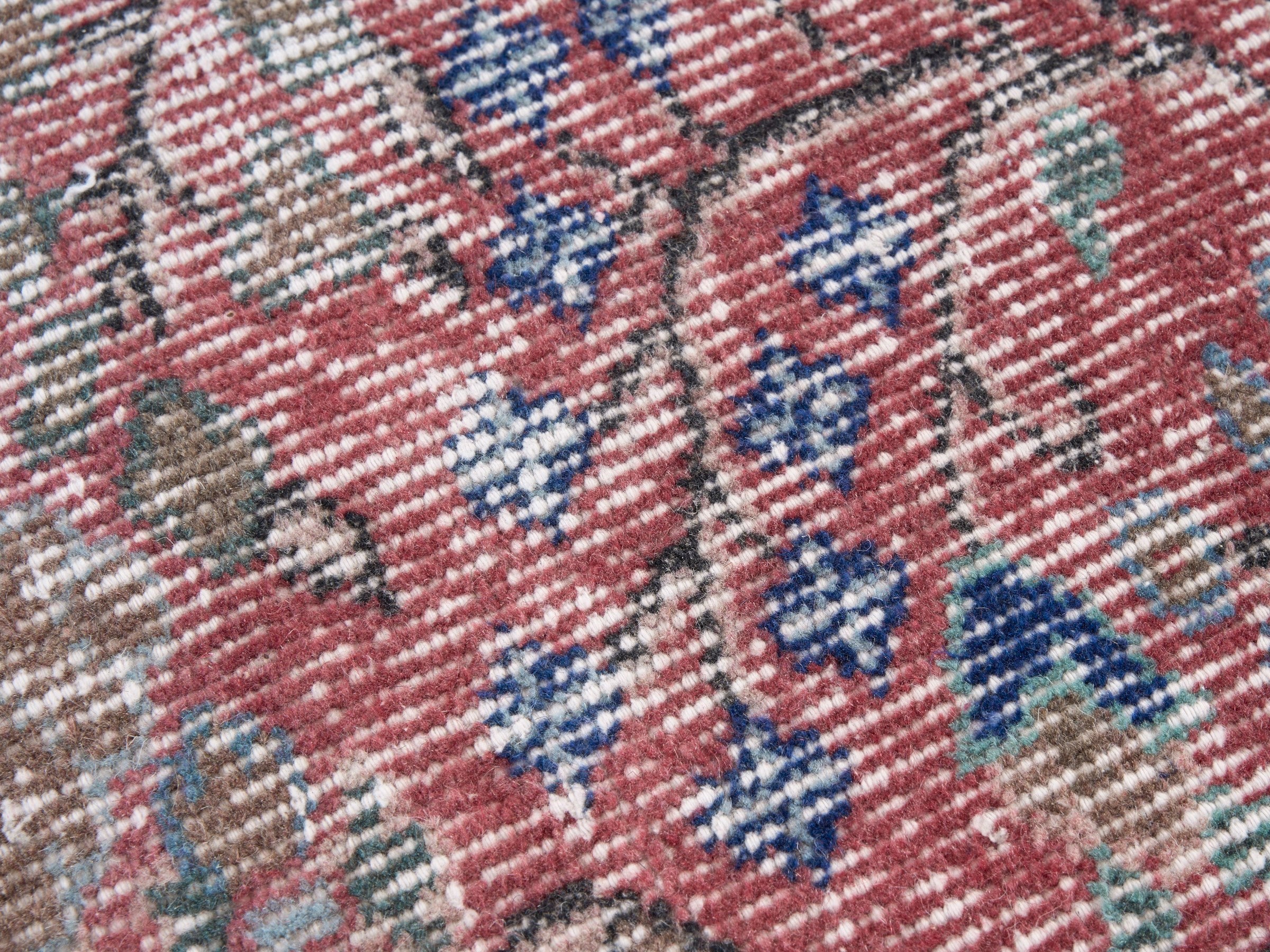 Turkish Isparta area rug in faded red and muted pink, view 7 of 10