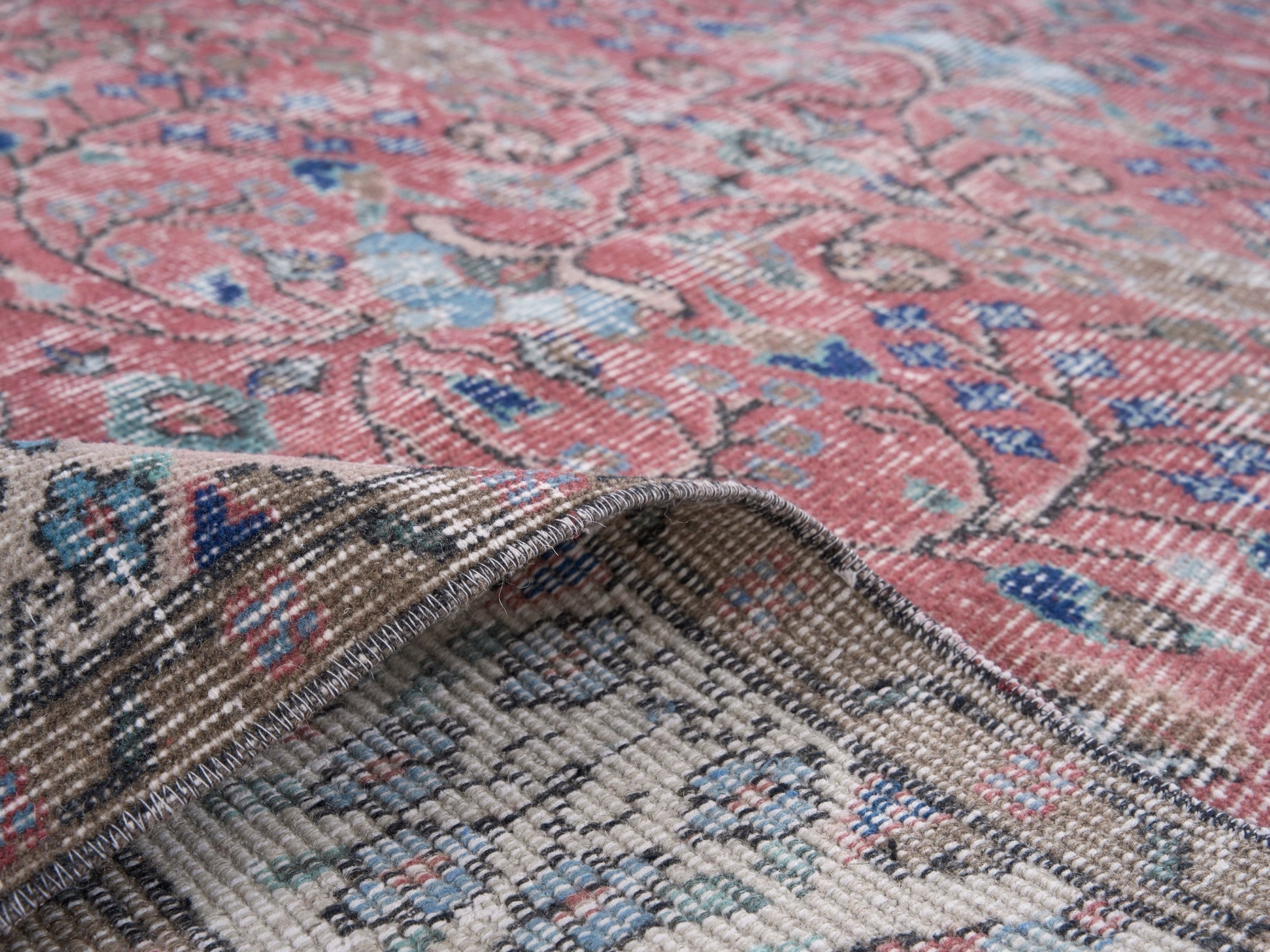 Turkish Isparta area rug in faded red and muted pink, view 9 of 10