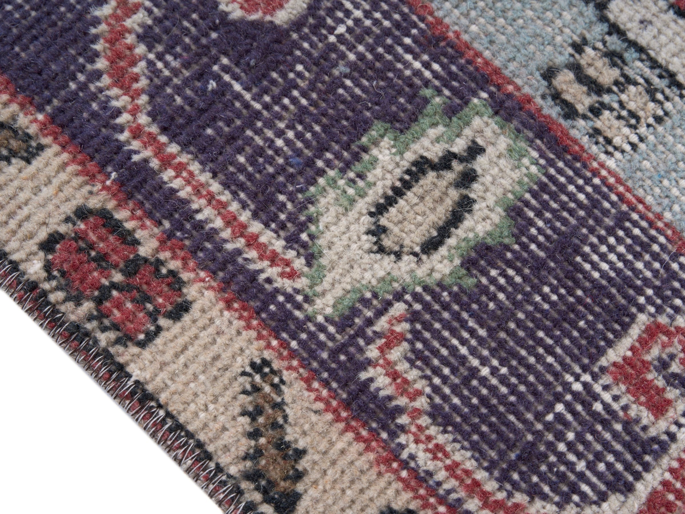 Turkish Isparta area rug in faded red and navy, view 6 of 10