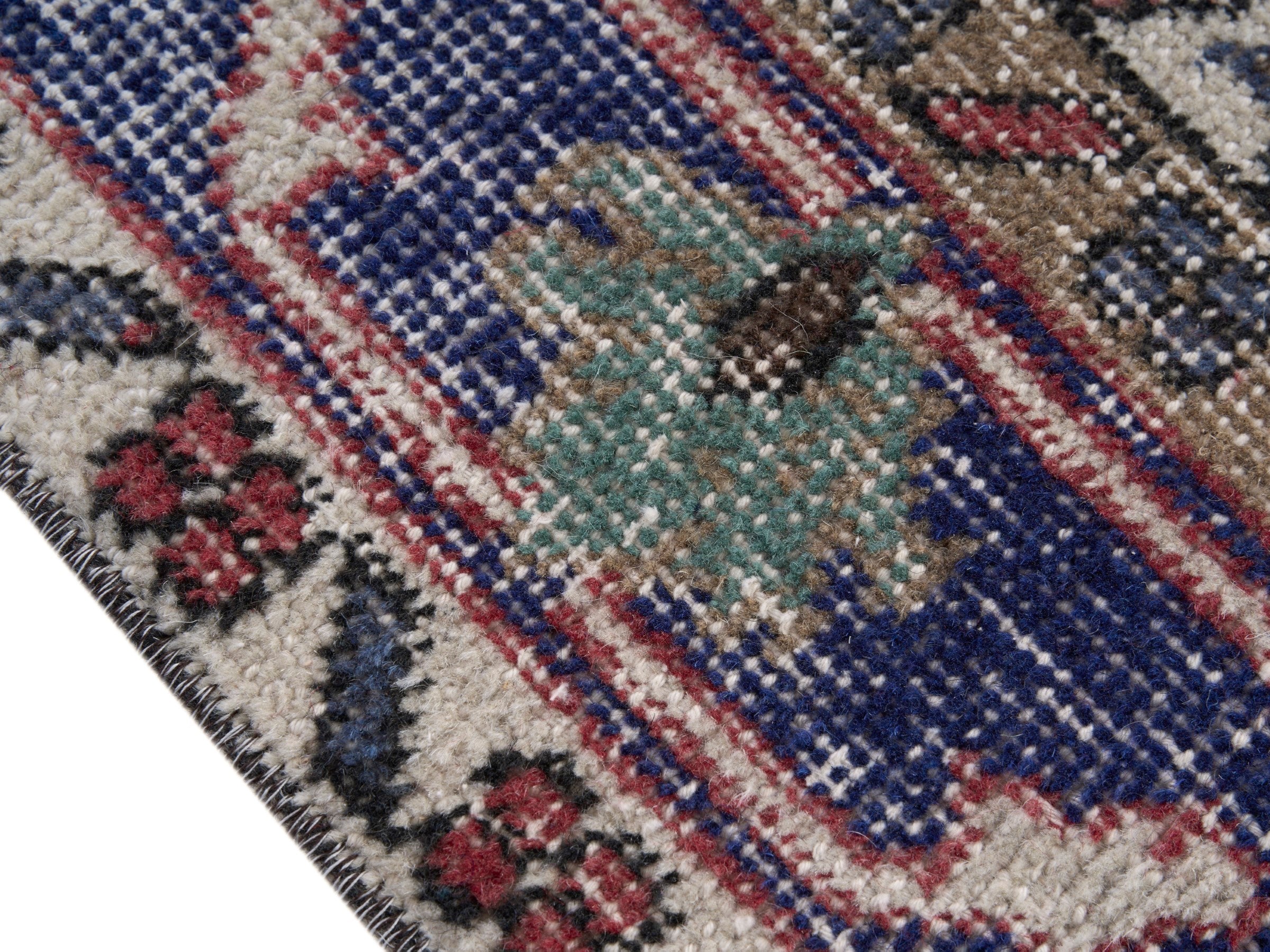 Turkish Isparta area rug in rust and navy, view 6 of 10