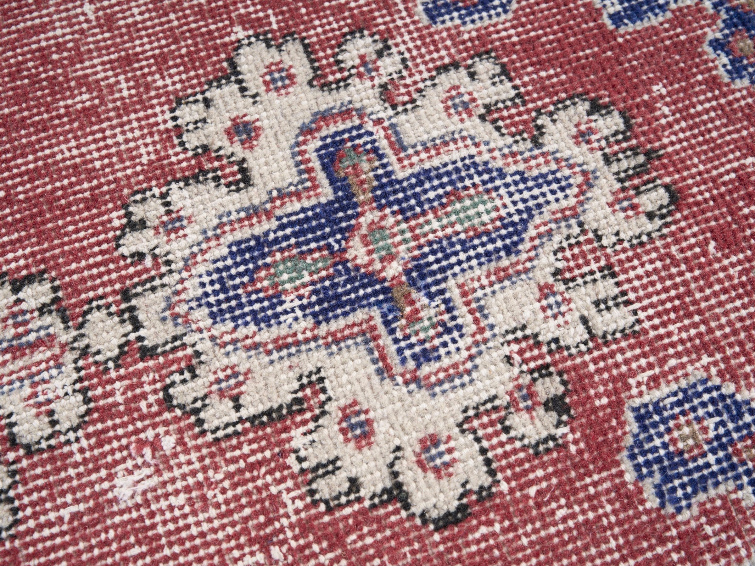 Turkish Isparta area rug in rust and navy, view 7 of 10