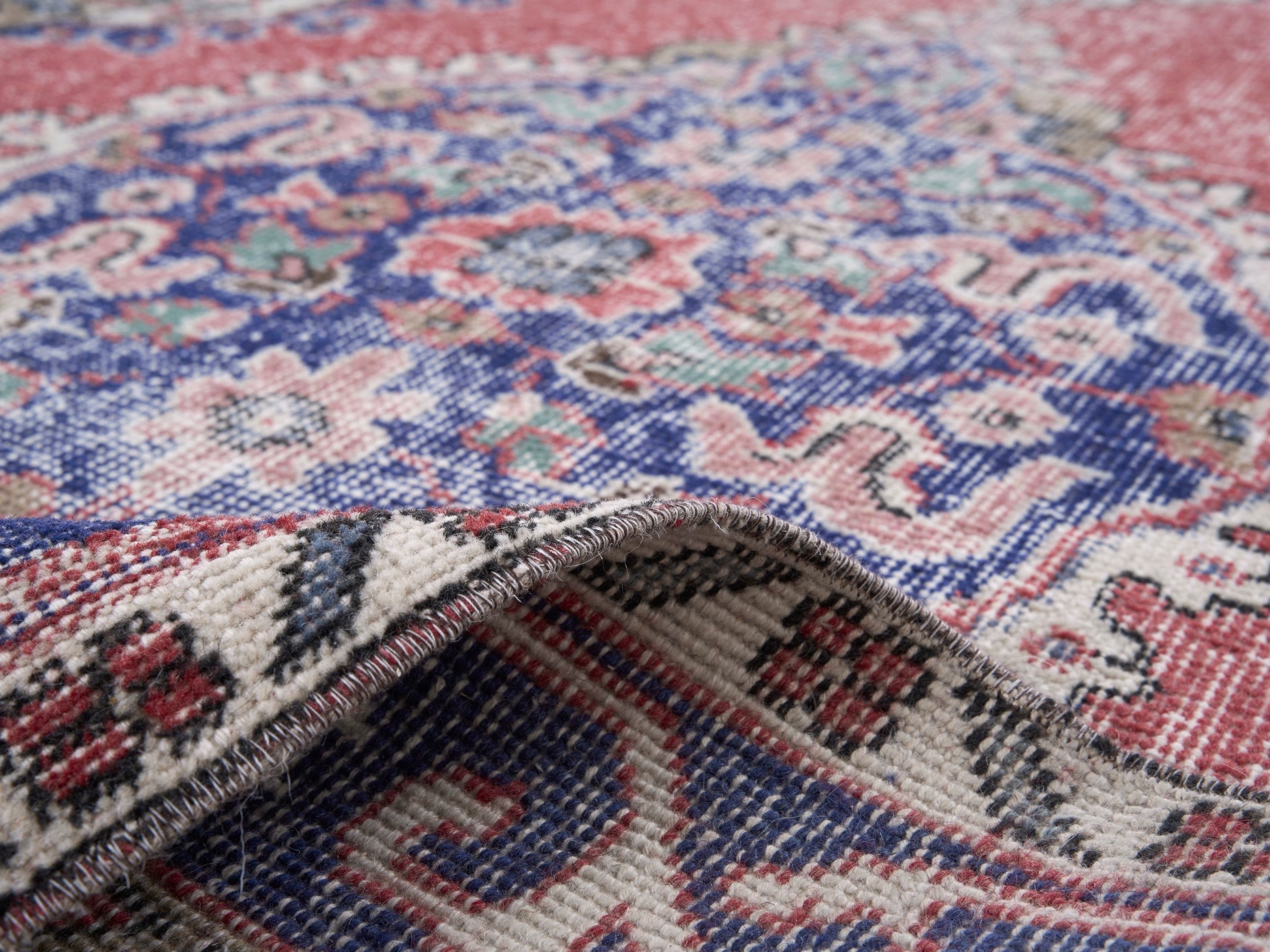 Turkish Isparta area rug in rust and navy, view 9 of 10